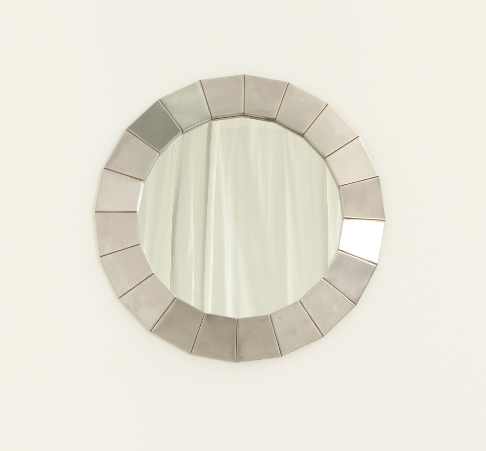 Round wall mirror from 1960's, Spain. Made of brushed steel pieces.