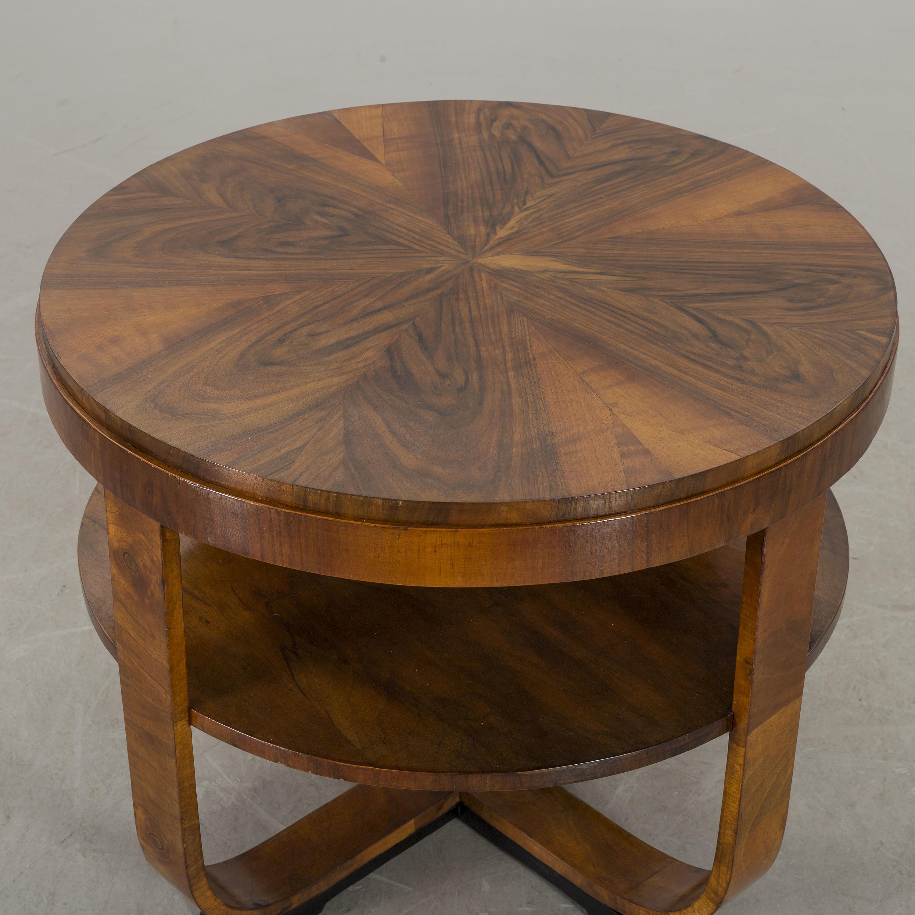 Beautiful Art Deco style side table made of walnut with ebonized feet.  A second table (in Europe now but being shipped to the US) will be available if pair needed.  