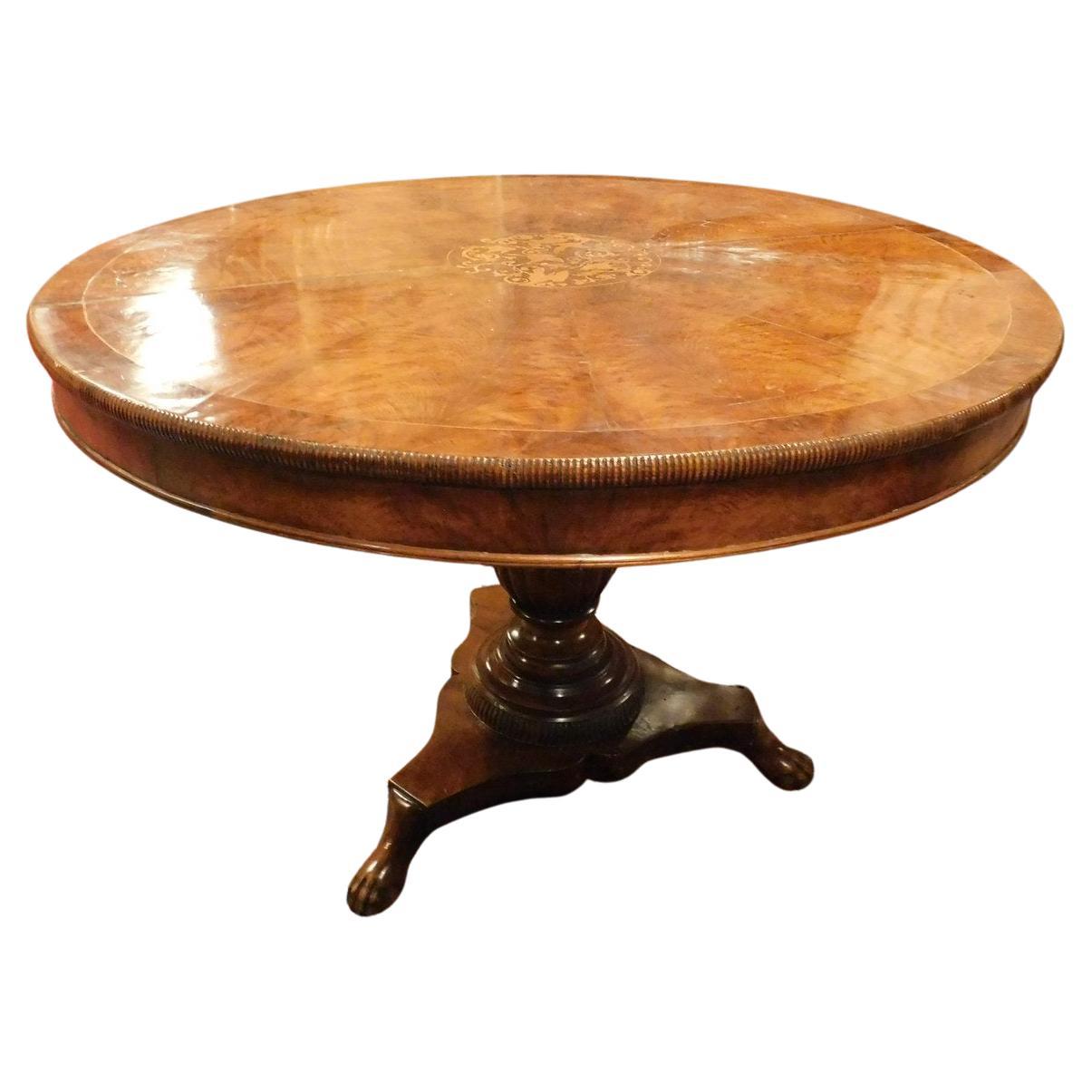 Round walnut center table with inlay, carved leg, Italy