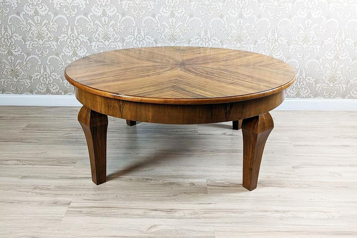 Round Walnut Coffee Table from the Mid-20th Century

We present you a walnut coffee table from the mid. 20th century. The top is of a grant size and the legs are straight.
This table is in original condition, has not been restored. There are some