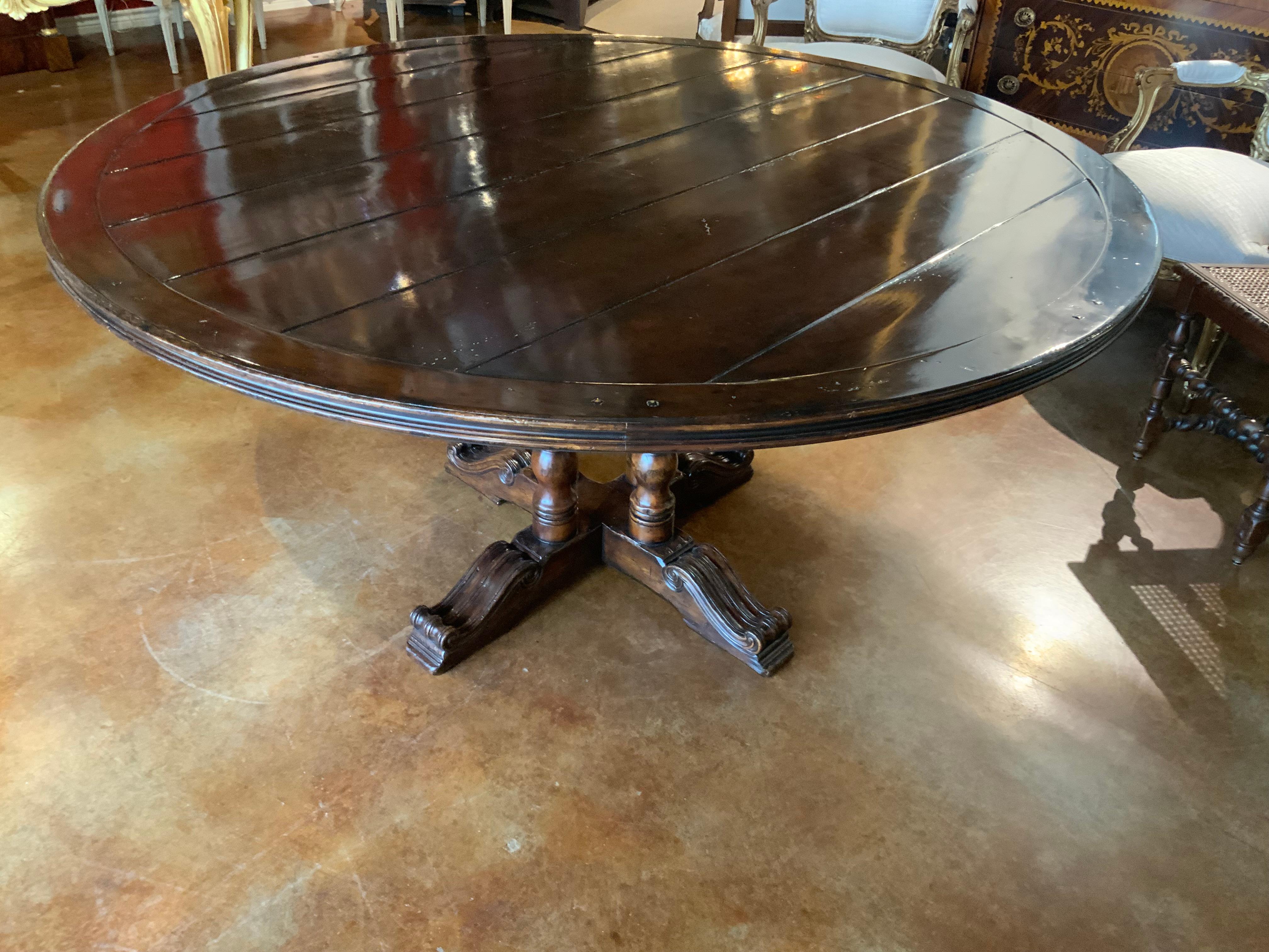 Round walnut dining table on a pedestal Four post carved leg, 60” diameter  4
