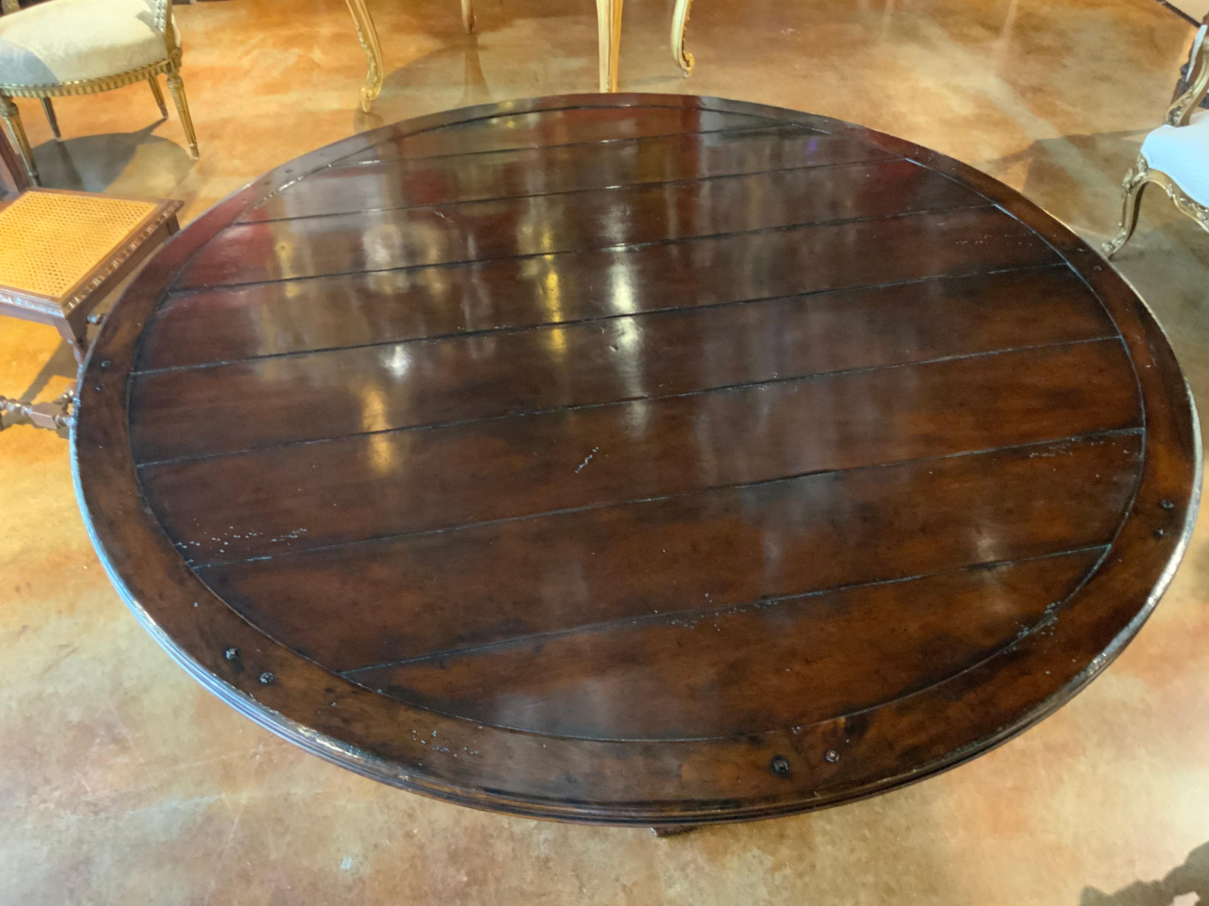 Round walnut dining table on a pedestal Four post carved leg, 60” diameter  3