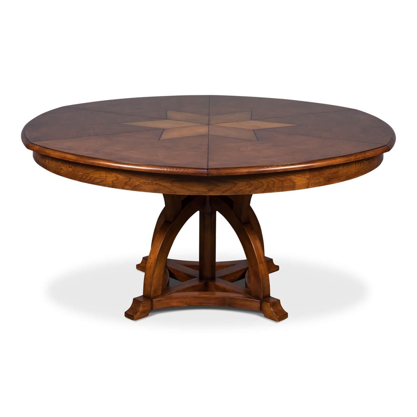 Round walnut extension dining table. The tabletop features a beautiful star design constructed of walnut and white oak veneer, and it sits upon a base inspired by timber frame architecture.

This dining table has self-storing leaves and can easily