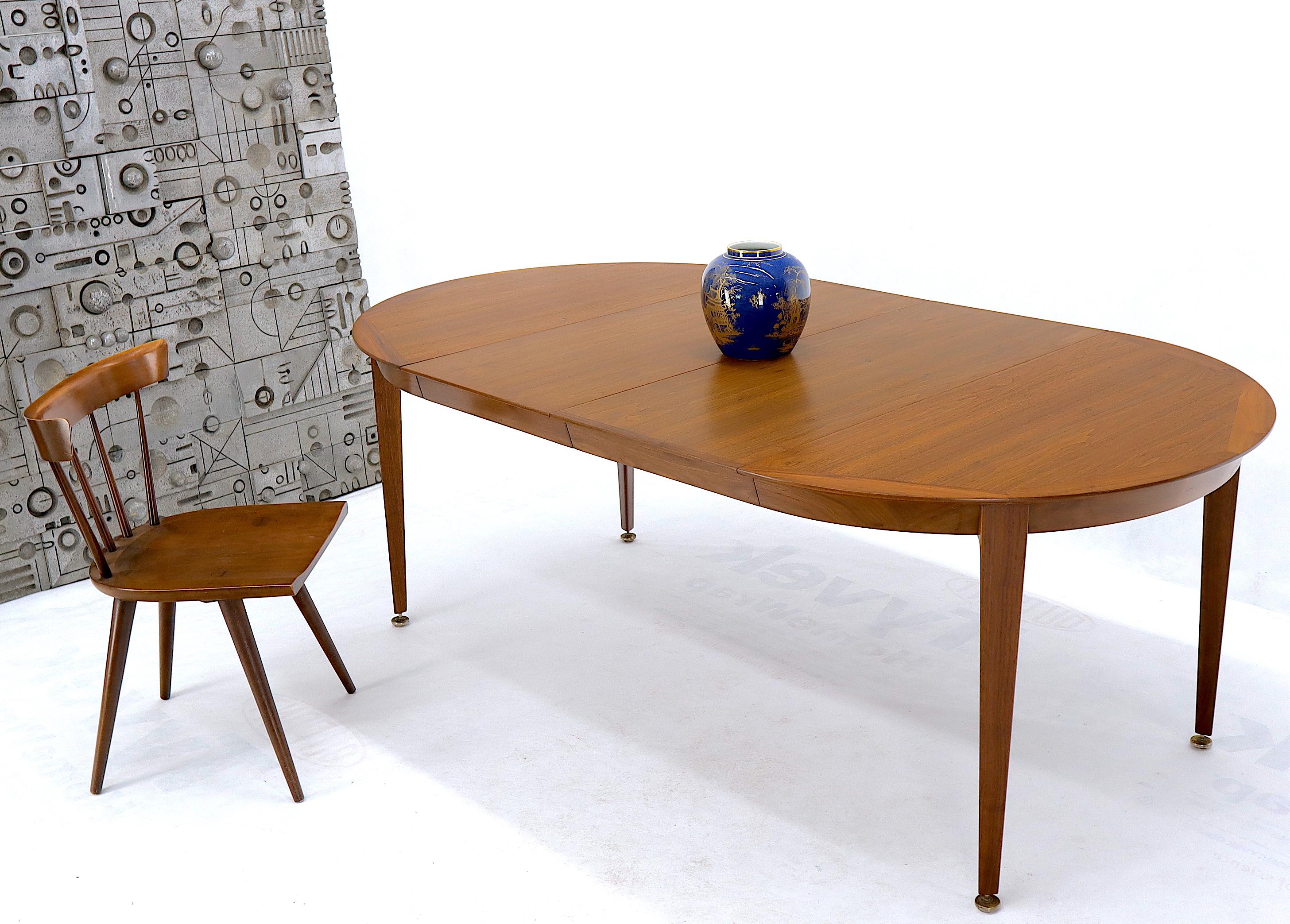 Mid-Century Modern walnut dining room table on tapered legs with 2 18