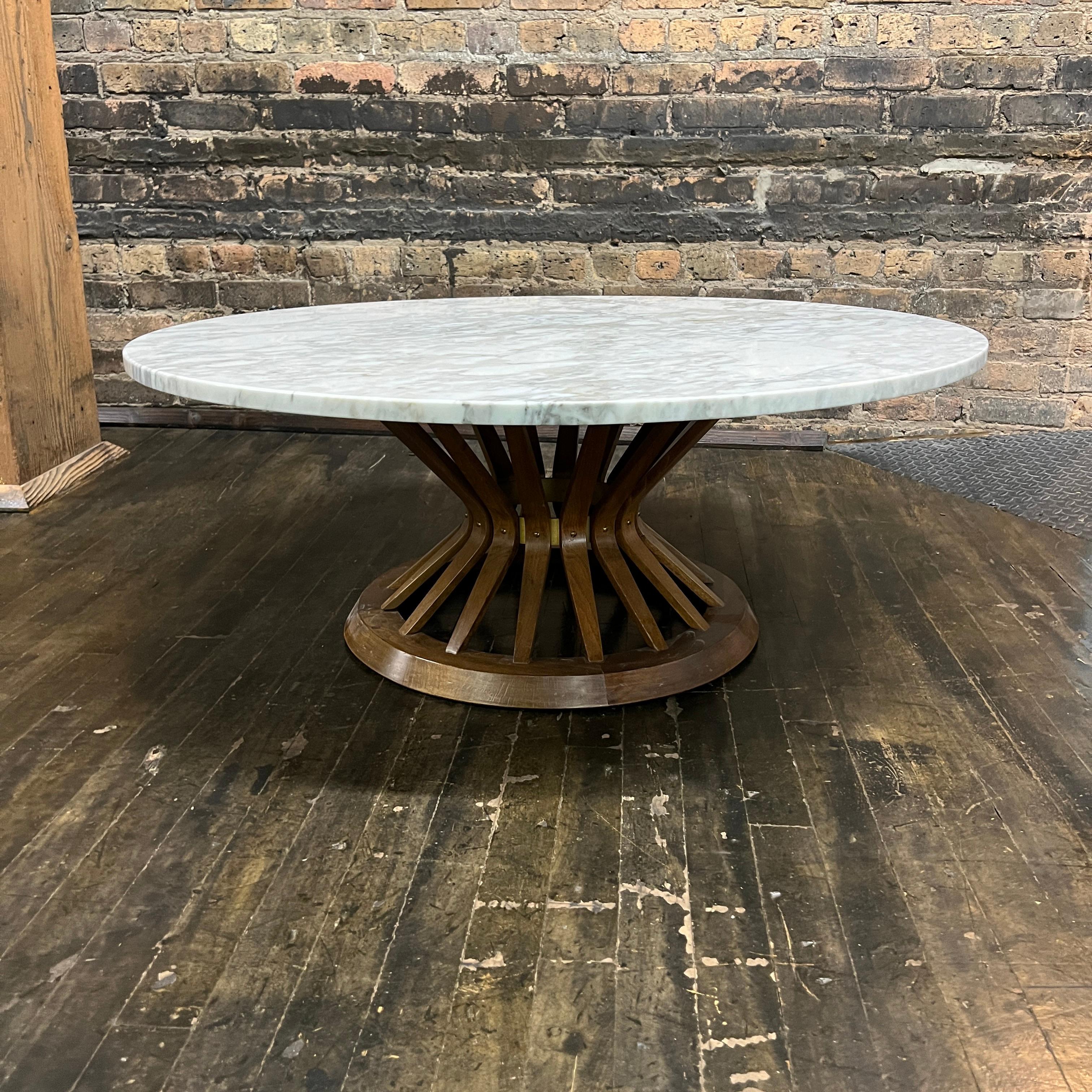 Beautiful round coffee table in the style of Edward Wormely for Dunbar (although this example doesn't have a Dunbar tag nor the typical travertine or glass top you'd expect of the Dunbar original).  Typically referred to as the wheat sheaf table,