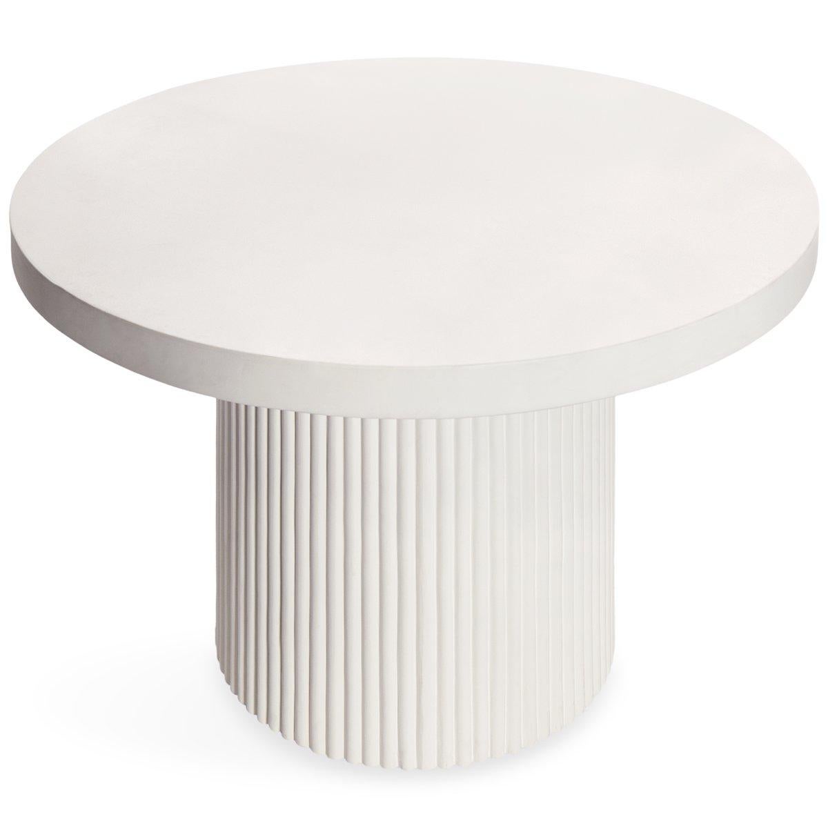 This design features clean lines and vertical reeding on the base. Made of tough, pure white concrete, this table can be used indoors or outside, where ever you want to dine in style! The simplicity of the top provides a great backdrop for all of