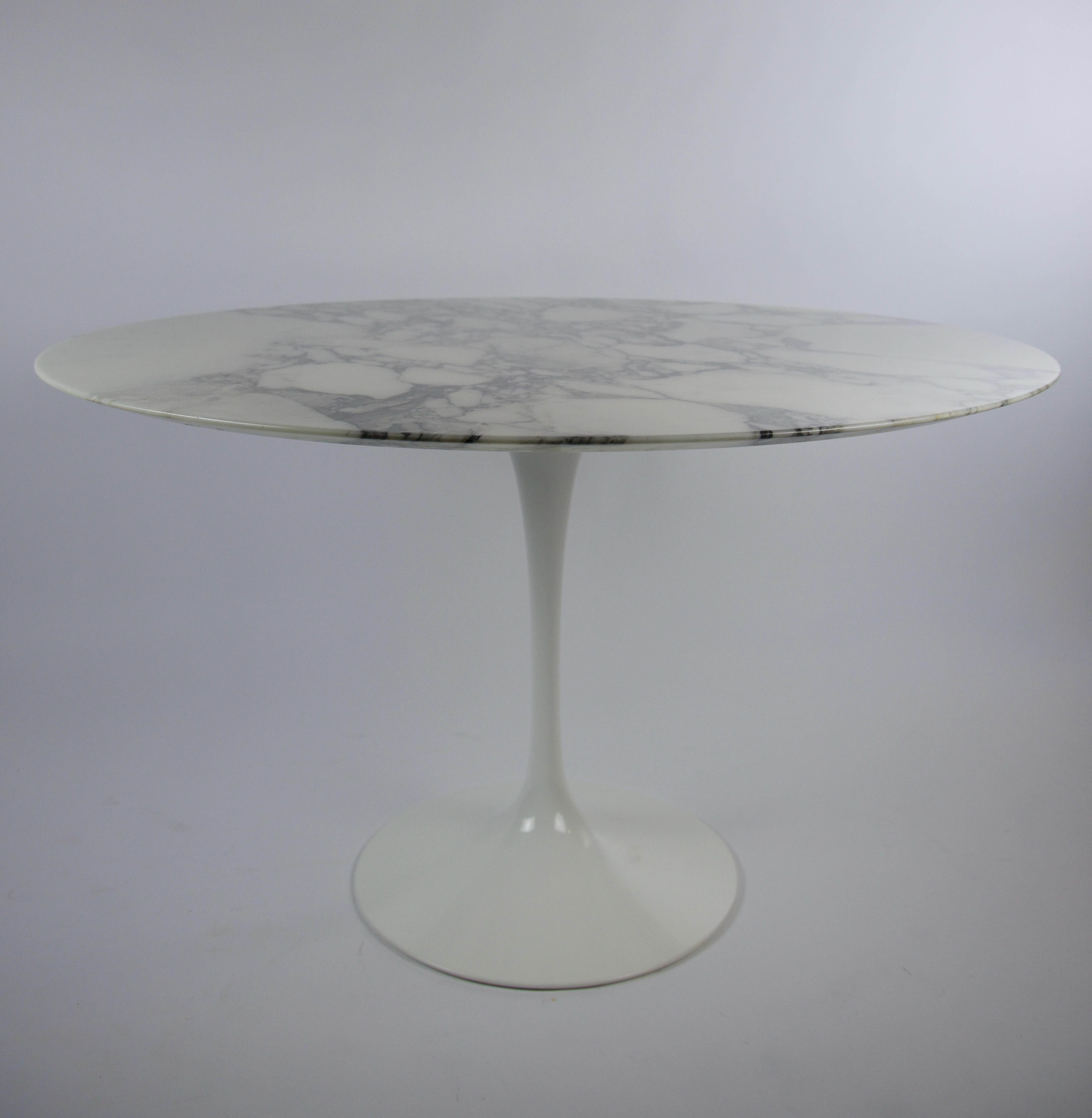 The tulip chairs that were with this table have a tag that has the date 2009. So this is a fairly new Round White Marble Dining Table by Eero Saarinen for Knoll. A few nicks around the edge of the marble. The chairs are also listed Ref: