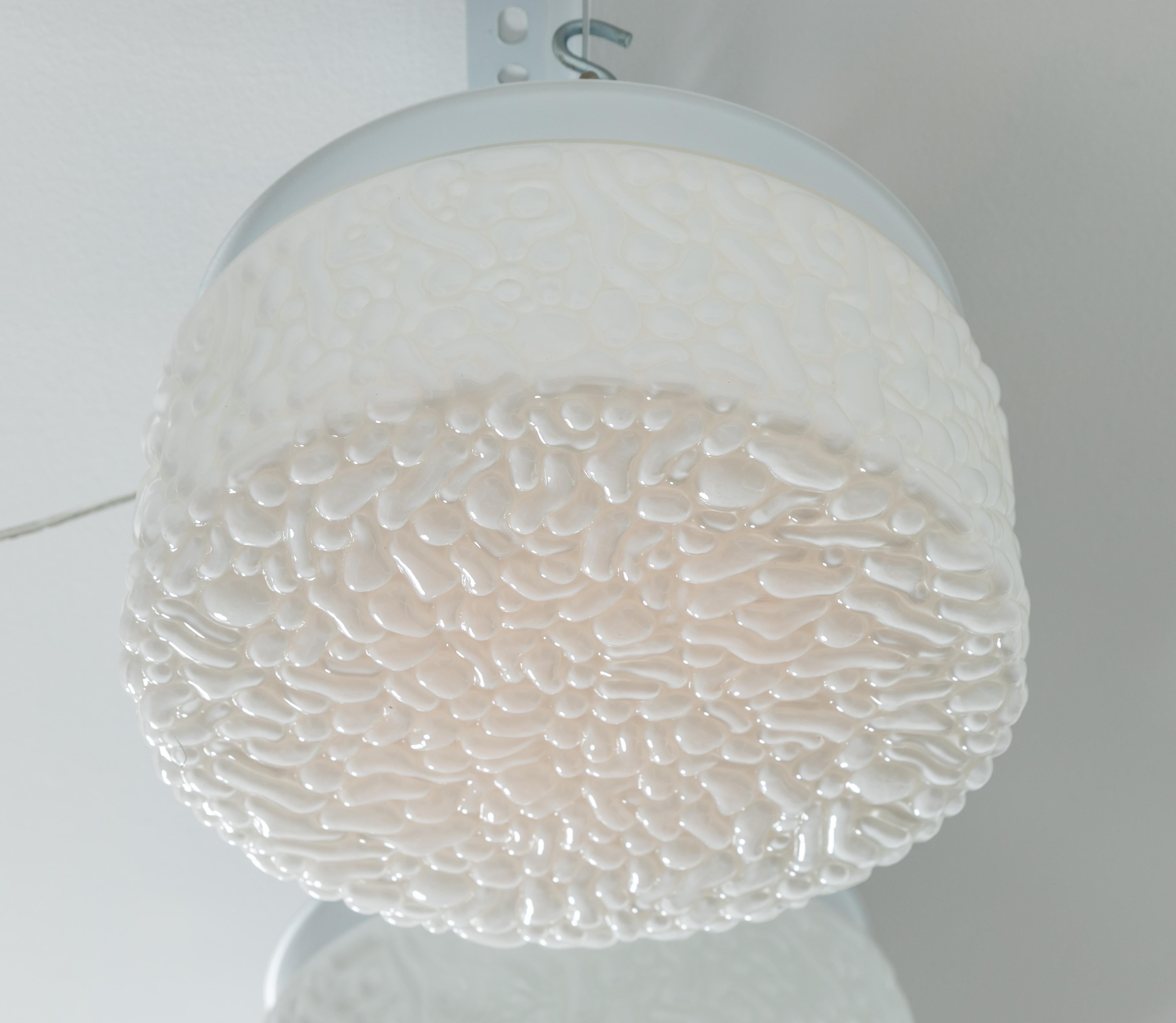 Round white opaque textured glass flush mount.