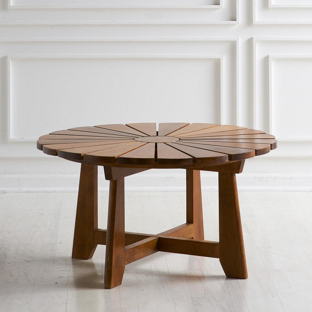 A beautiful handcrafted coffee table; most likely carpenter made in the South of France. This round table features 20 wedge sections with a circle in the middle, France, 1960s. 

Dimensions: 33.25” D x 17.25” H

Condition: Very good. Some minor