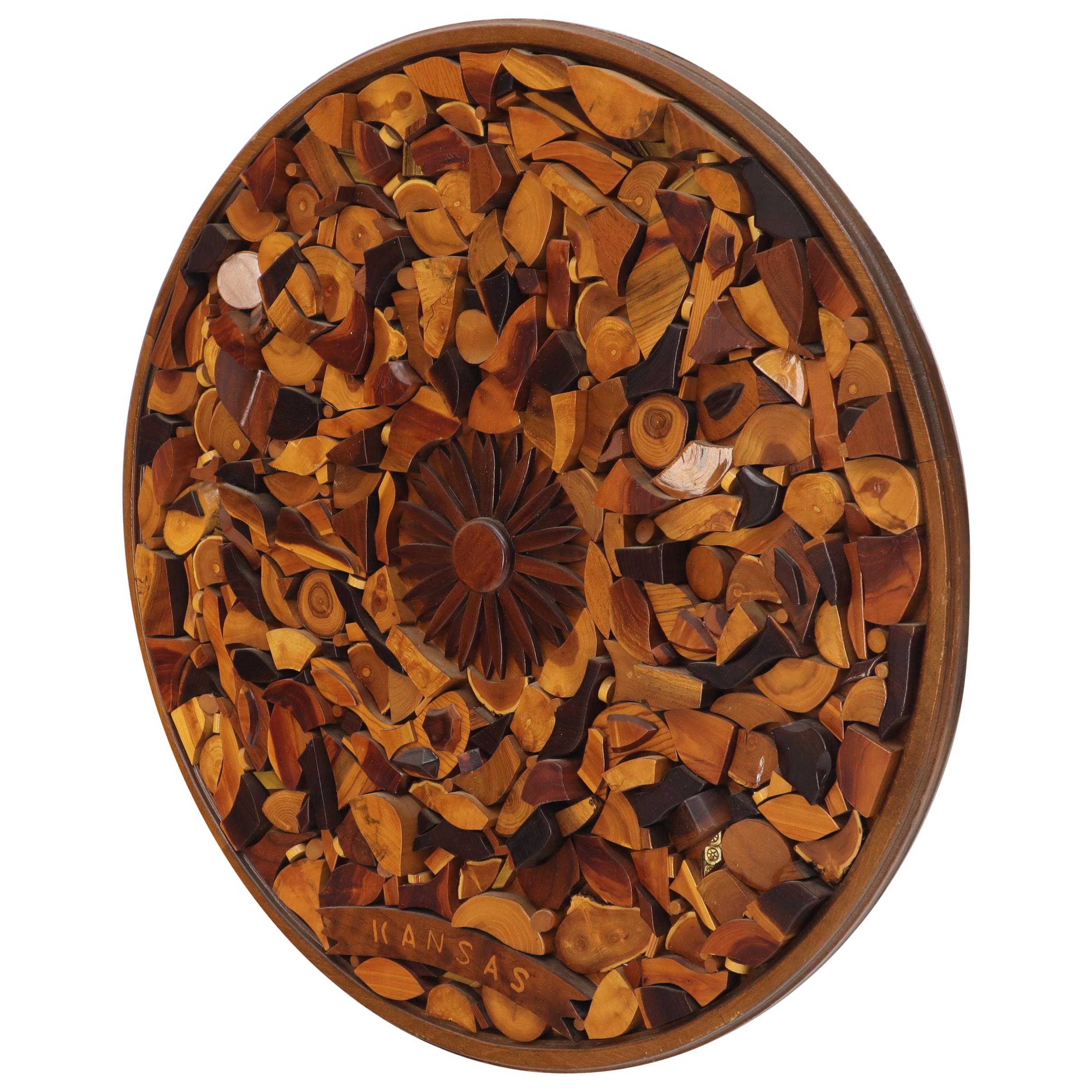 Large Mid-Century Modern round wall sculpture wood pieces collage with sunburst rosette in the center.