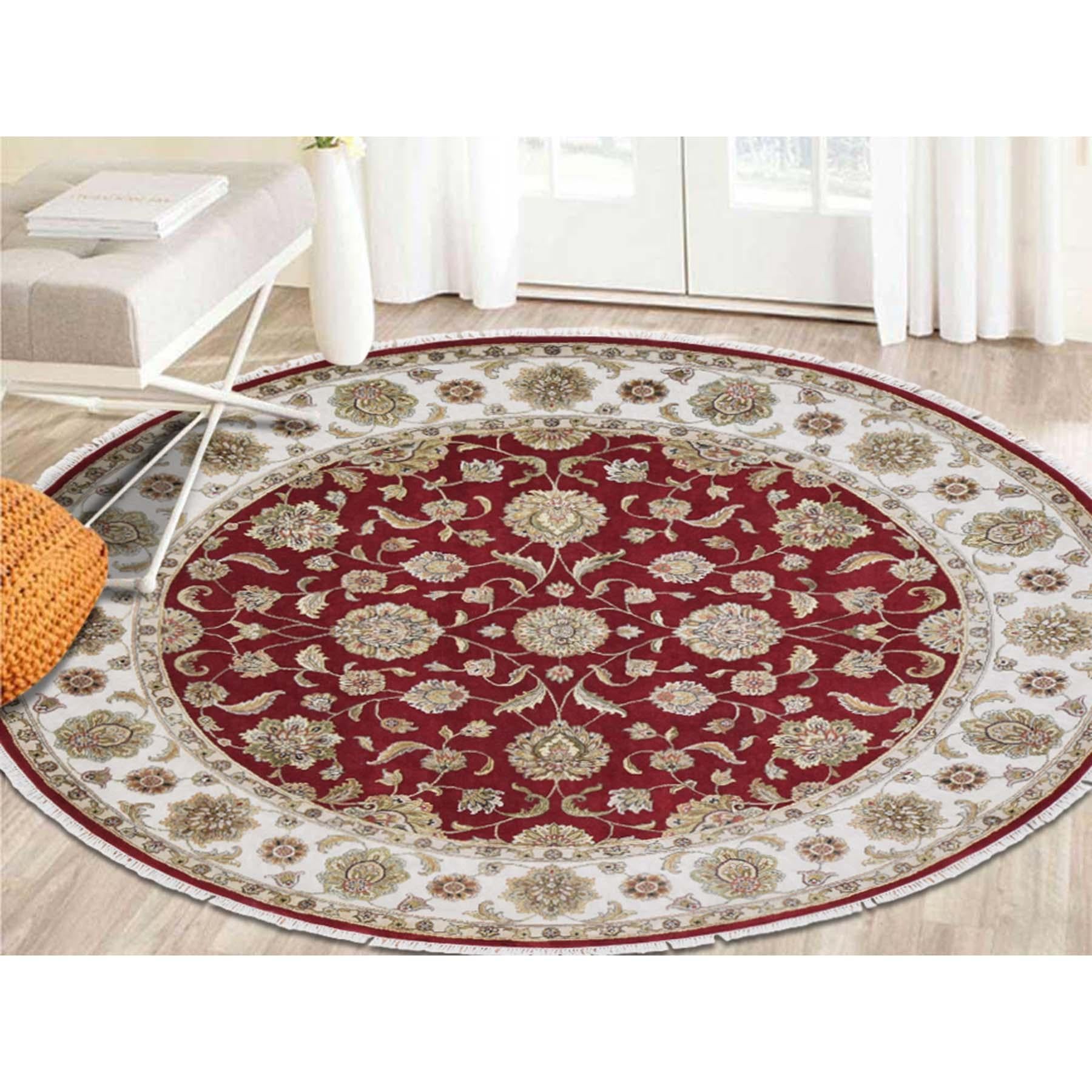 This is a truly genuine one-of-a-kind round wool and silk red Rajasthan hand knotted Oriental rug. It has been knotted for months and months in the centuries-old Persian weaving craftsmanship techniques by expert artisans. Measures: 8'0