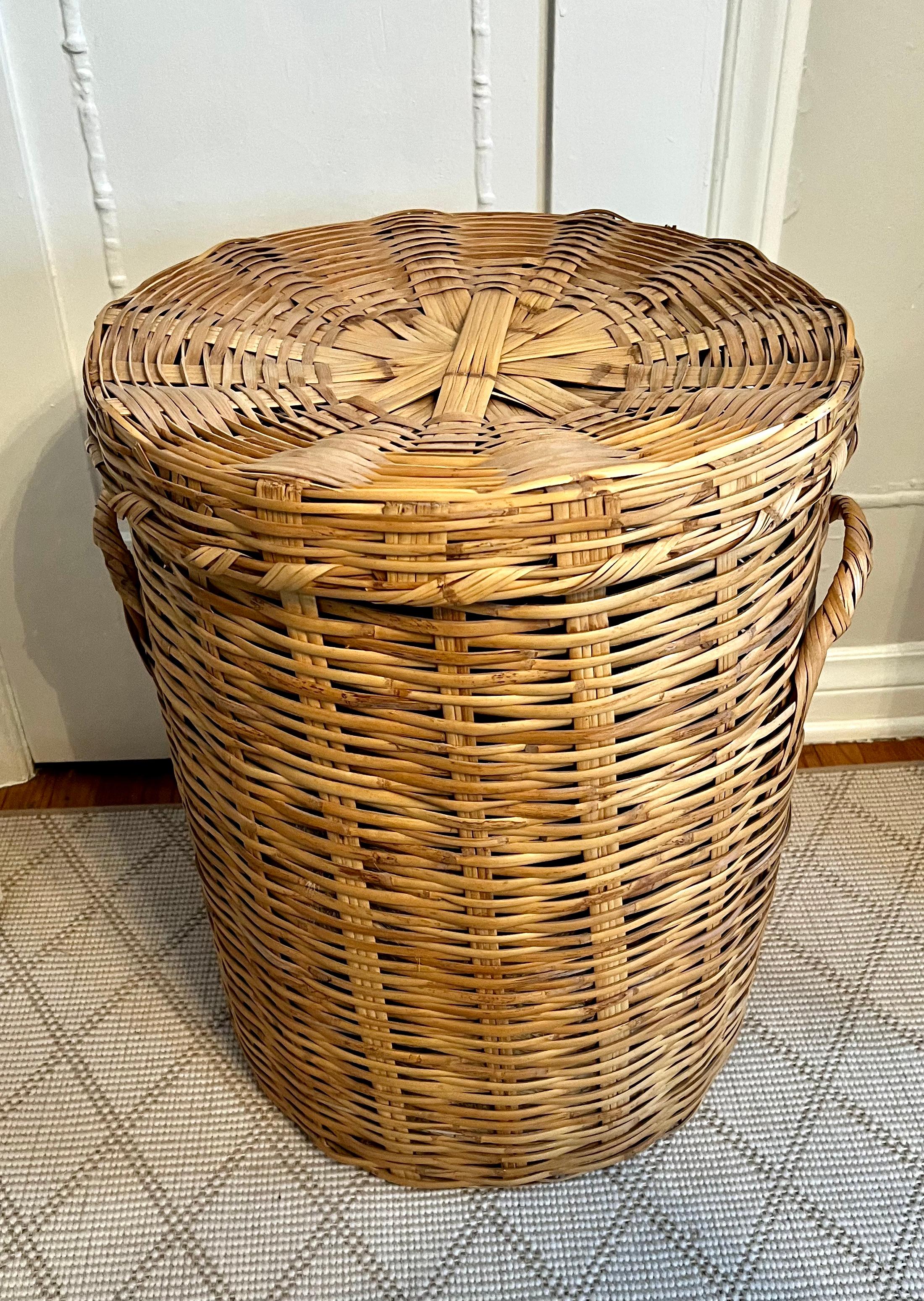 A lovely woven basket - a nice decorative piece or can be used for laundry or rags?  the piece is woven and great for occasional use.   Strong enough for linens, but we would not suggest wood or kindling as the weaving is not tightened enough to