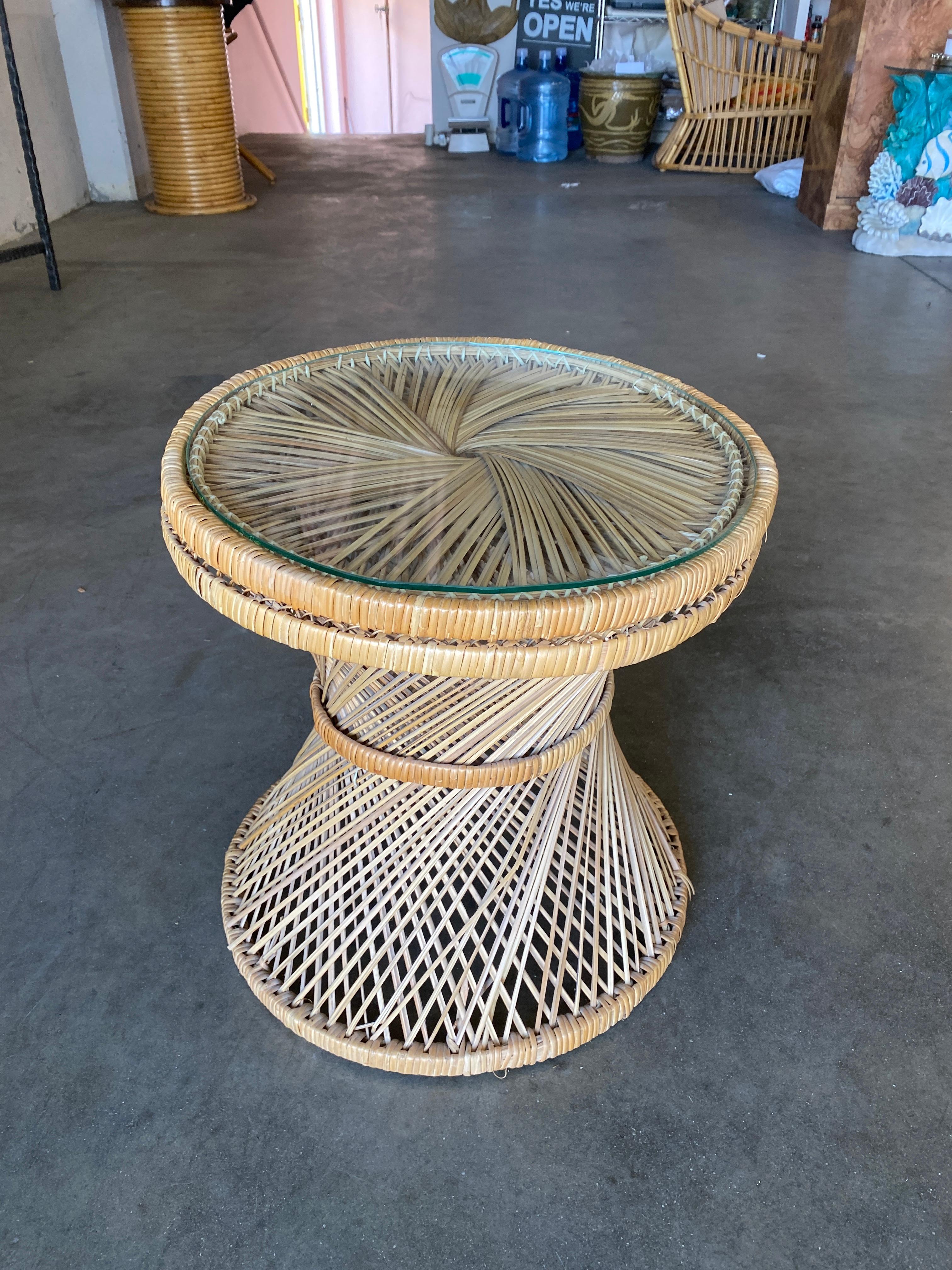 Round Woven wicker side table w/ glass top.

Circa 1970.