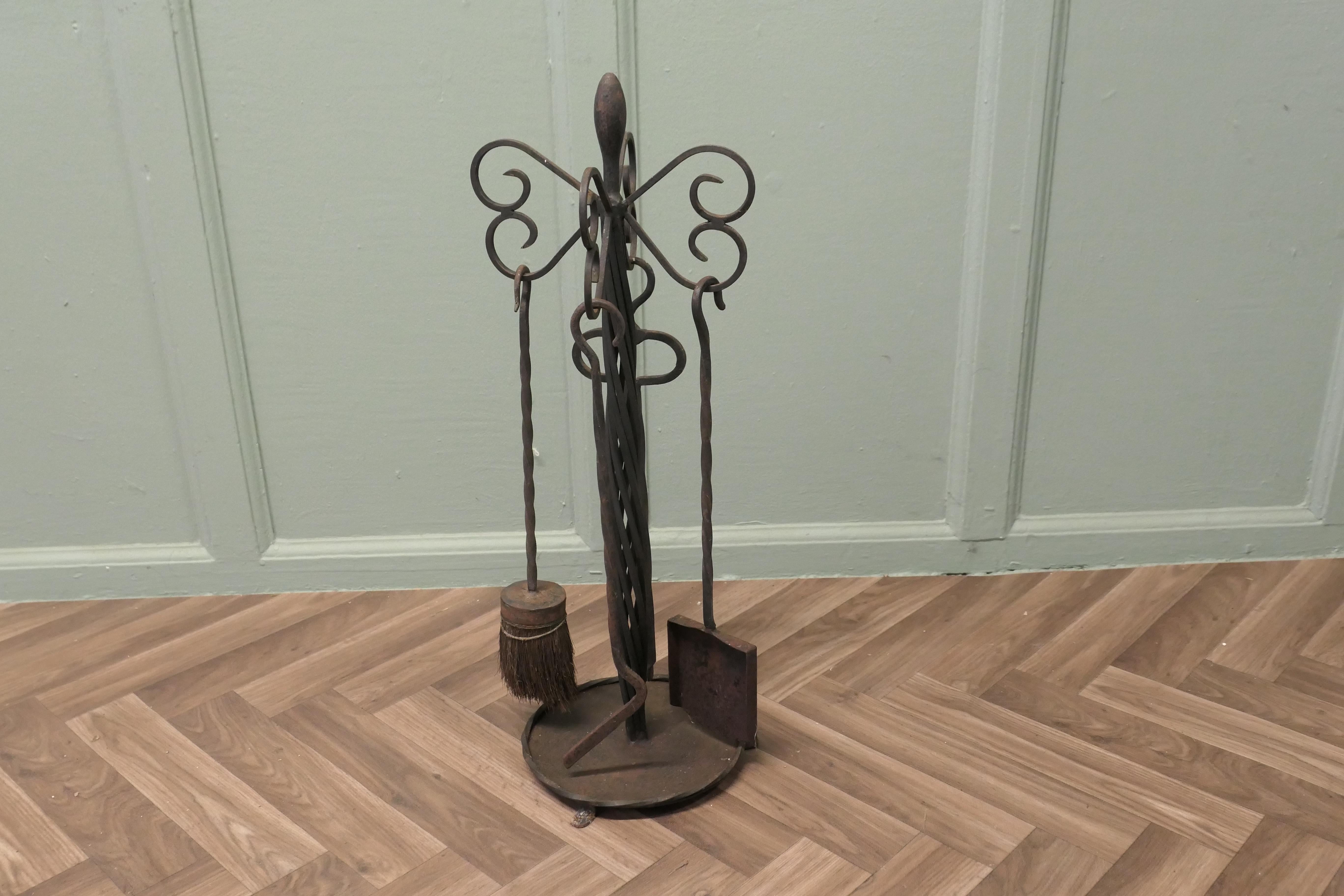 Round Wrought Iron Fireside Companion Tool Set

This set hangs on its own stand, poker, shovel, tongs and brush made in wrought Iron 
The stand 25” tall and 9” in diameter
Taw166
