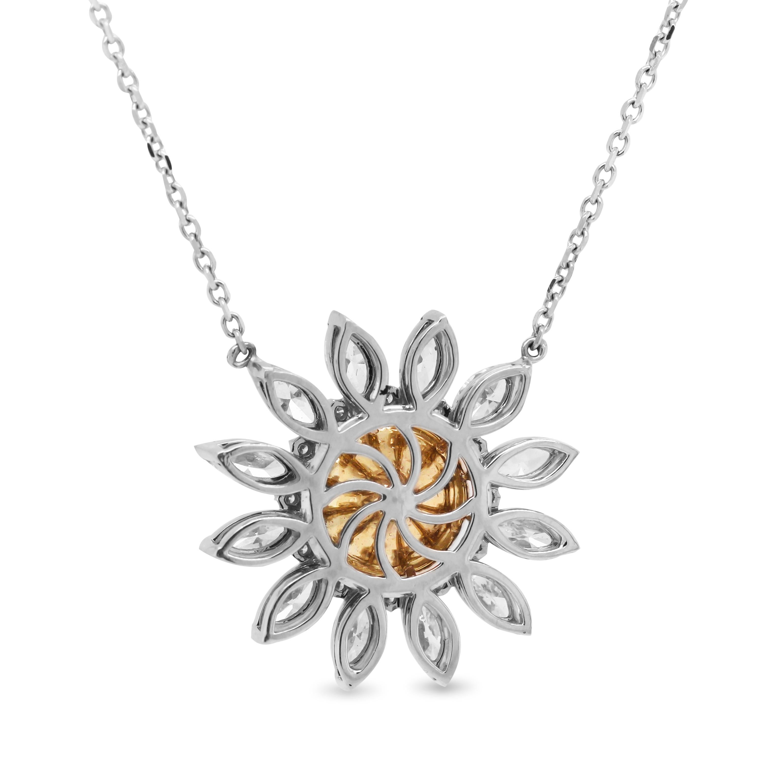 18K White Gold Starburst Floral Pendant Necklace with Round Yellow Diamond Center and Marquise White Diamonds

2.26 carat round Yellow Diamond center

2.40 carat carat apprx. G color, VS clarity marquise diamonds

Pendant is 1 inch in width. 

Chain