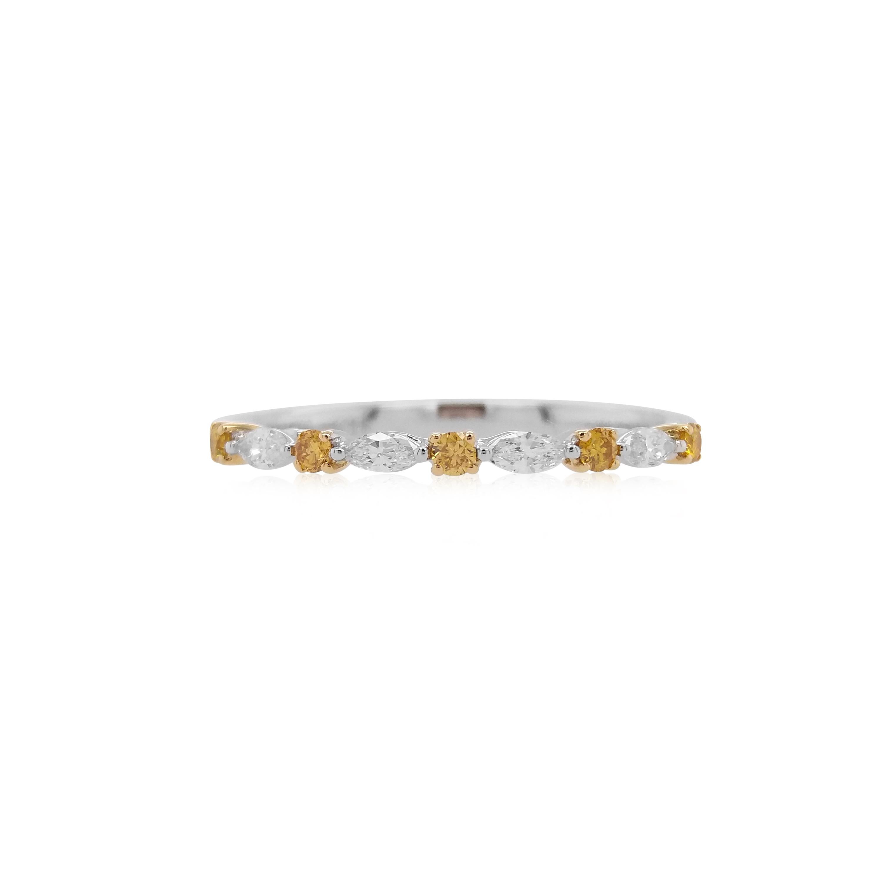 An elegant ring with alternate designs of Round brilliant cut Yellow diamonds and Marquise White diamonds set in a band of white diamonds

Natural Yellow Diamonds- 0.09 cts
White Diamond - 0.13 cts

HYT Jewelry is a privately owned company