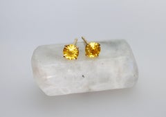 Borchie con zaffiro giallo rotondo in oro giallo 18 carati