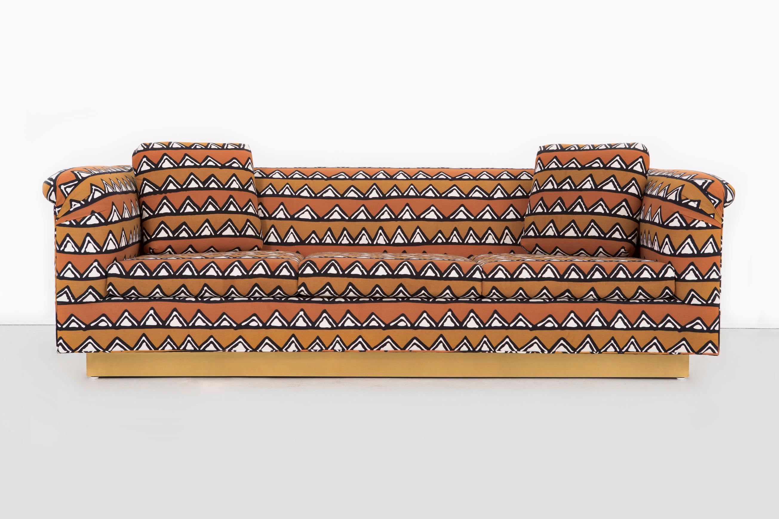 Sofa

Designed by Richard Himmel

USA, circa 1960s

Newly reupholstered in mud cloth from Zimbabwe with a brass base

Measures: 28” H x 90 ½” W x 35” D x seat 16 ½” H

Pictured with live edge coffee table by Jerry L Smuck (sold). 

Fabric sample