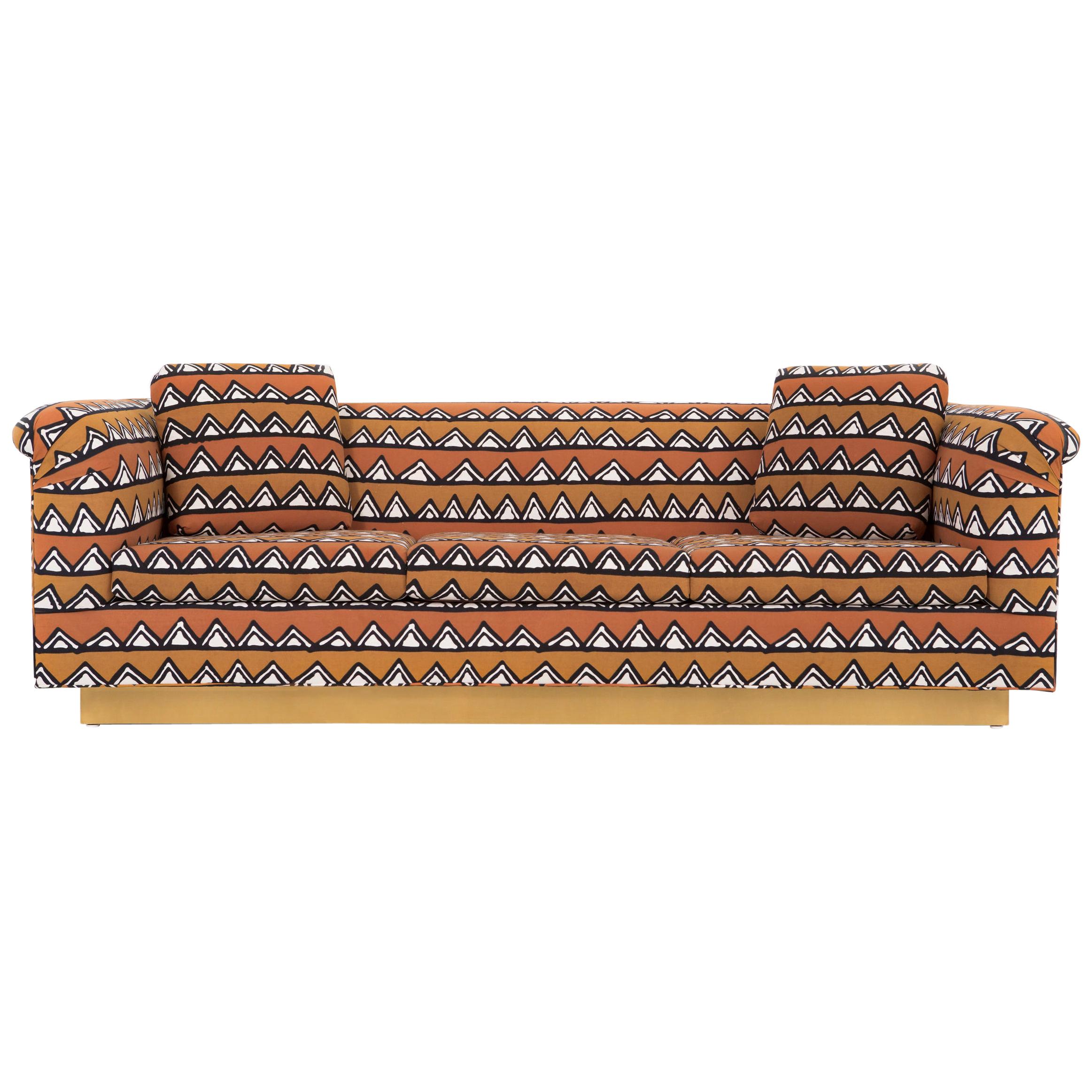 Sofa

Designed by Richard Himmel

USA, circa 1960s

Newly reupholstered in mud cloth from Zimbabwe with a brass base

Measures: 28” H x 90 ½” W x 35” D x seat 16 ½” H

Pictured with live edge coffee table by Jerry L Smuck (sold).
