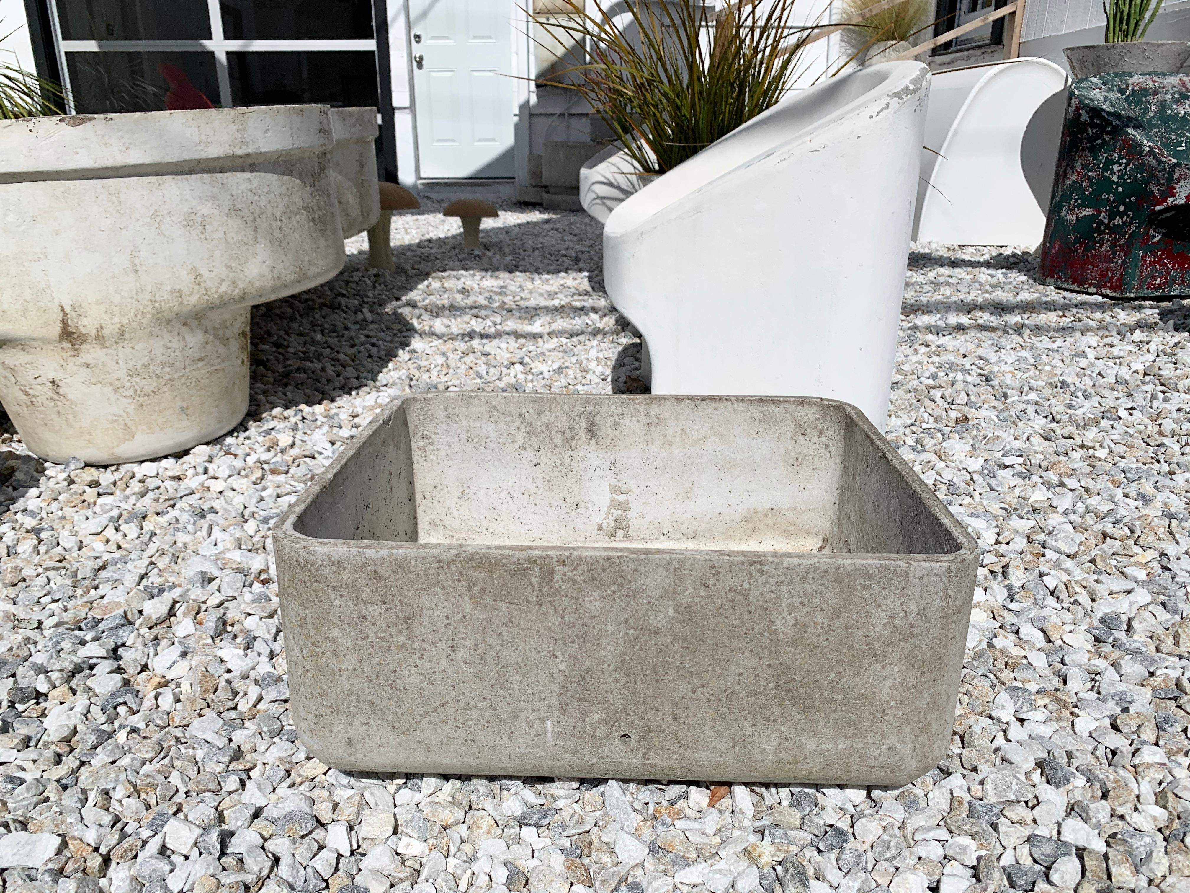 Fantastic set of 11 rectangular planters by Swiss architect Willy Guhl for Eternit. Interesting design in that the bottom and top has rounded corners. Very clean and cool design. Drainage holes on the sides and bottom. Great patina and age. Good