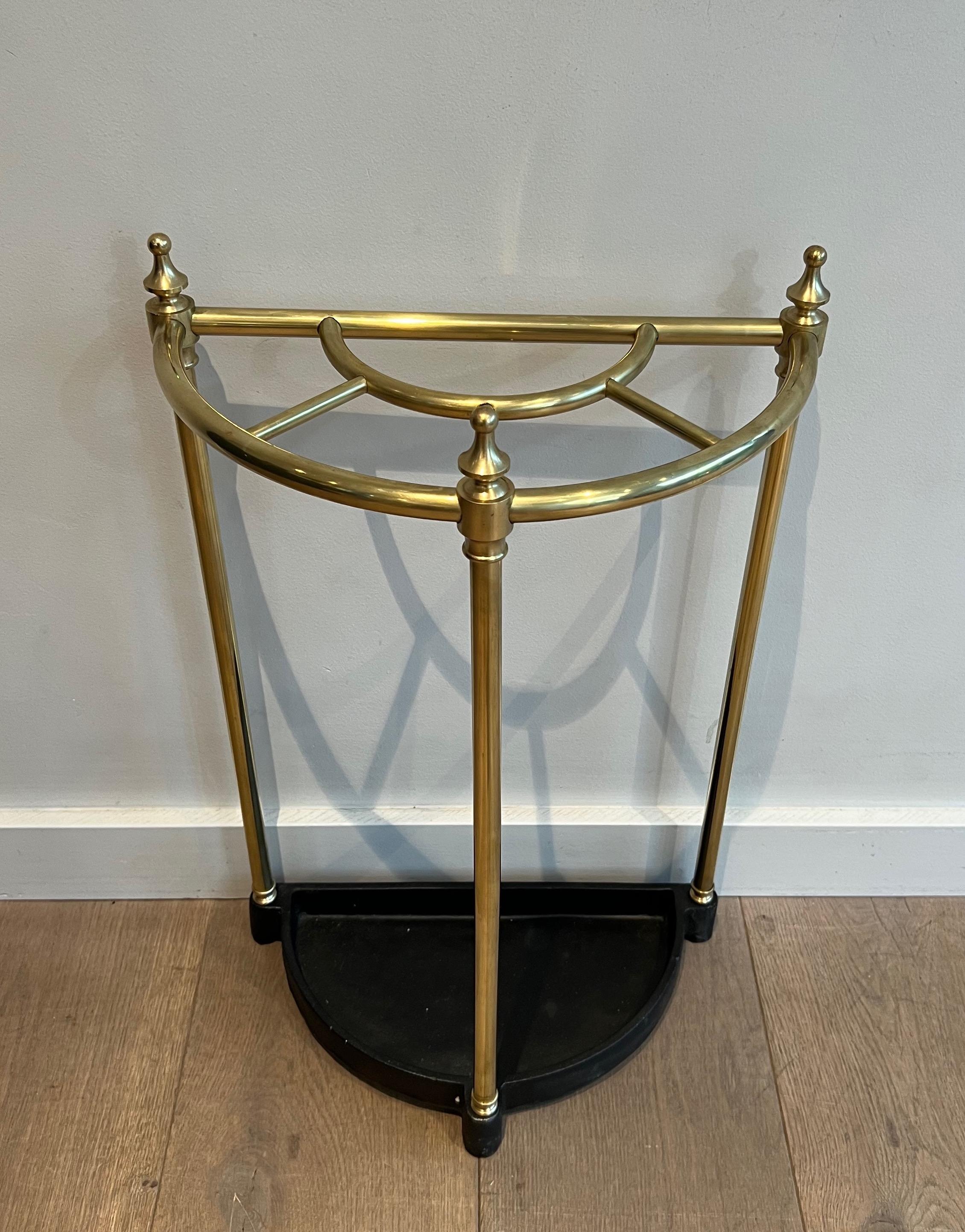 This rounded umbrella stand is made of brass and cast iron. This is a French work. Circa 1900