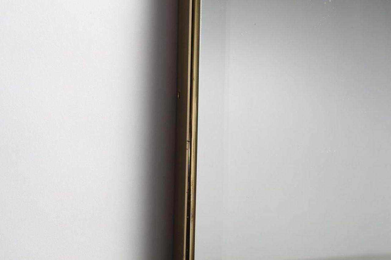 Italian wall mirror with rounded edges.
