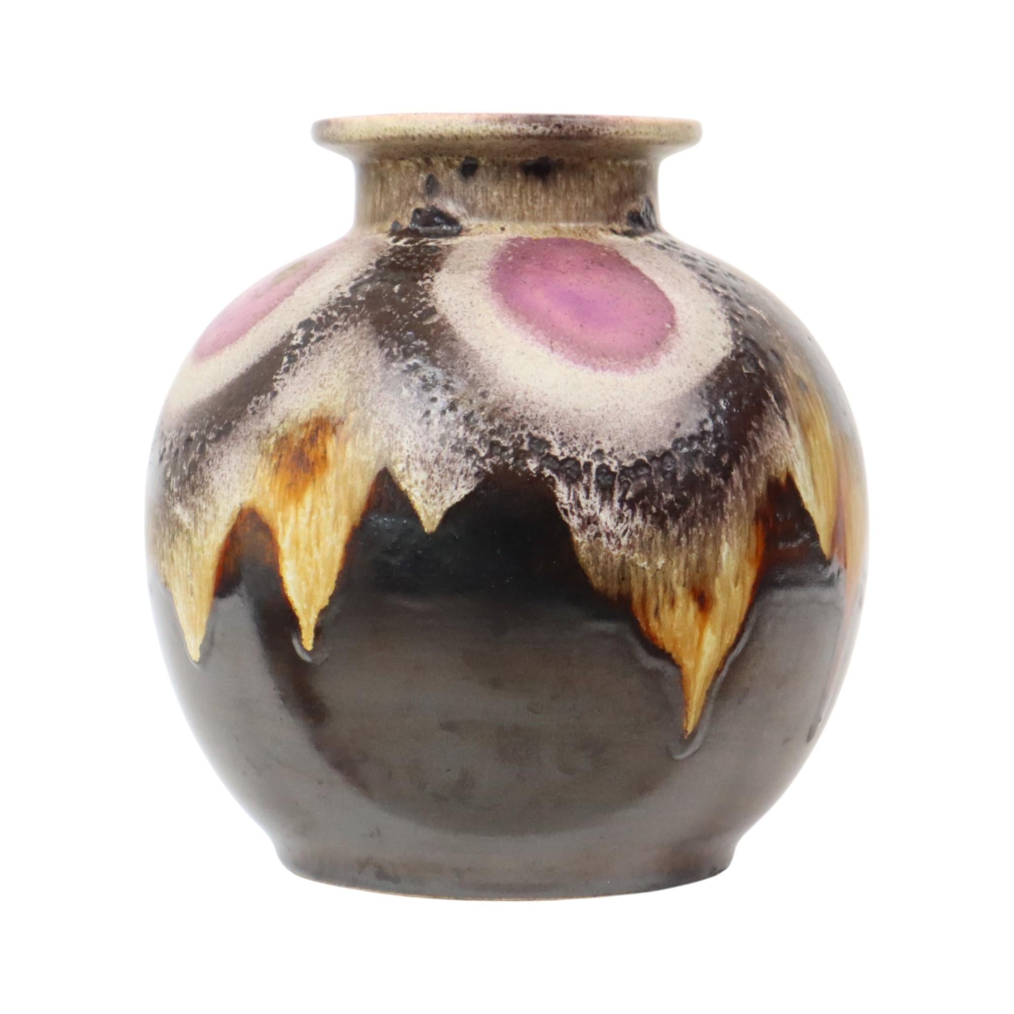 Beautiful vintage, rounded Fat Lava vase, brown with cream and purple accents, West Germany pottery, by Dumler & Breiden, marked and numbered 666-21 on the bottom, 1960s-70s. It still has remnants of the maker's sticker on the front.

West Germany