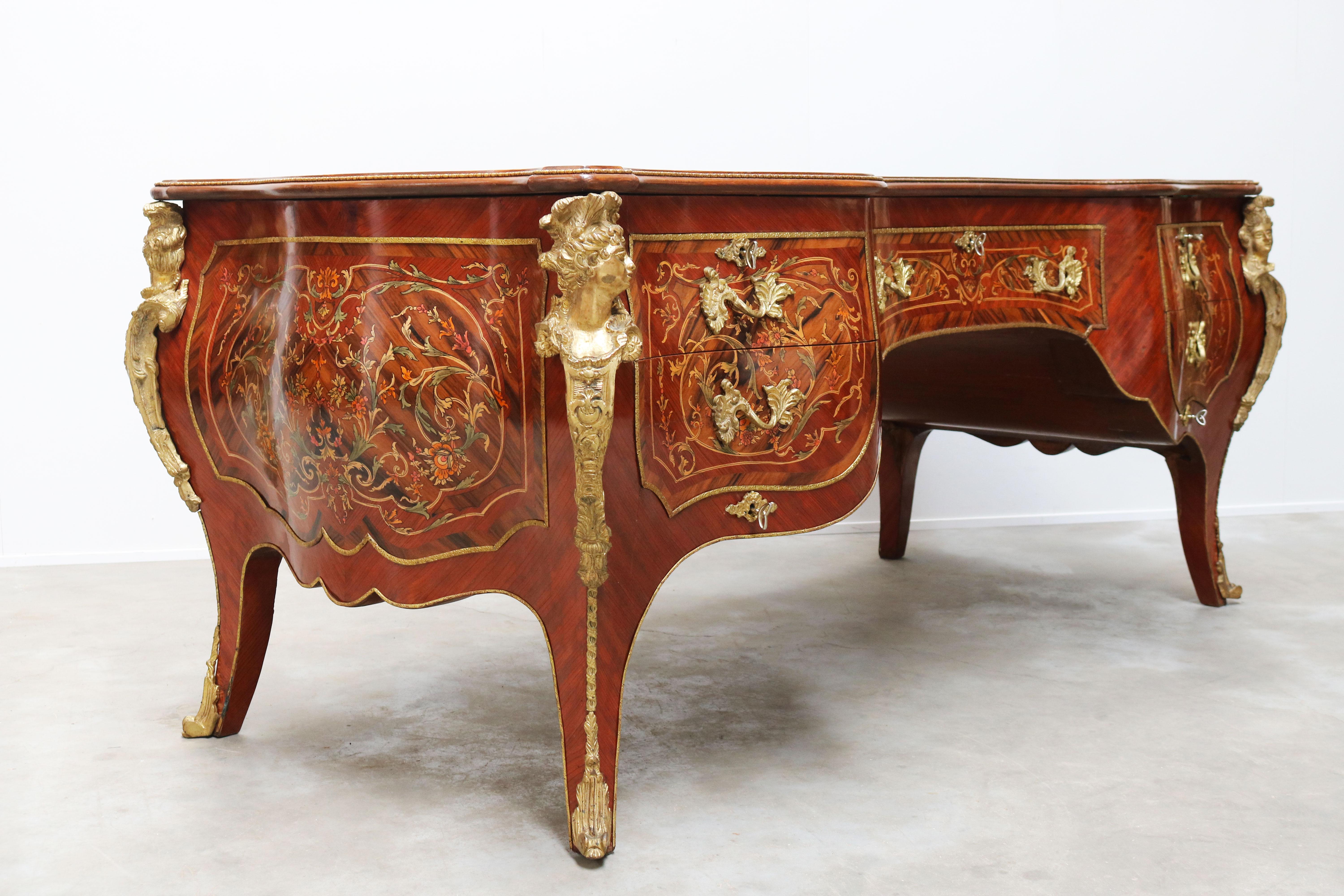 Breathtaking & impressive! This rounded Italian Louis XV style executive desk with inlaid wood & bronze. 
 A desk build to impress and impress she does, truly amazing craftsmanship and quality. 
Made in the 1950s as a custom order for a lawyer in