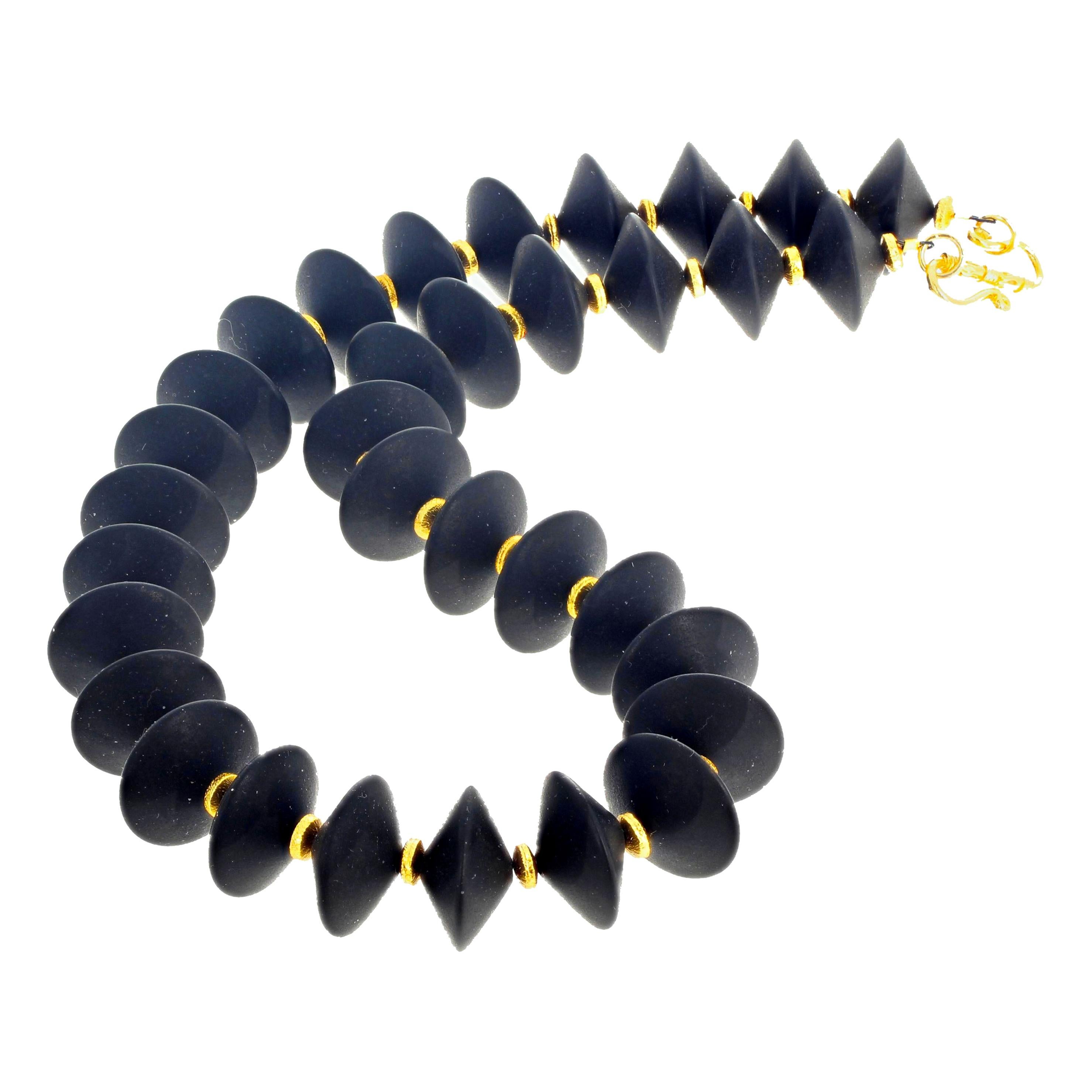 These lovely interesting Black Onyx rondels are 18 mm and are enhanced with tiny gold plated sterling silver little rondel spacers set with a gold plated easy to use hook clasp in this 17 1/2 inch long necklace.   
