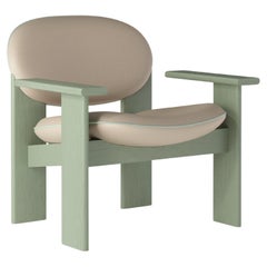 Rounded Sage Green Lounge Chair in Oatmeal Faux Leather — Archipen by NOOM