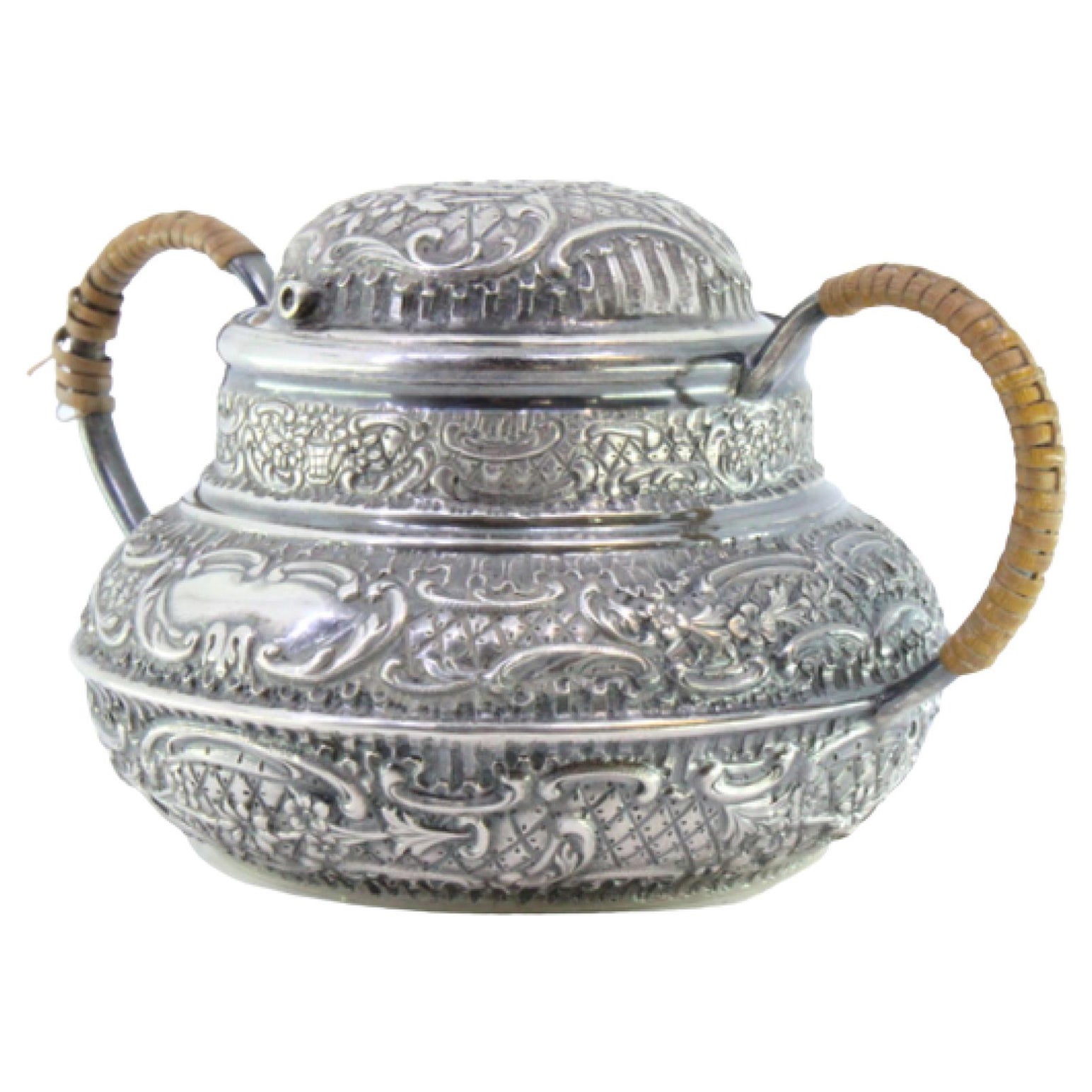 Rounded silver sugar bowl w/ reliefs around monogram plaque 
coated handles