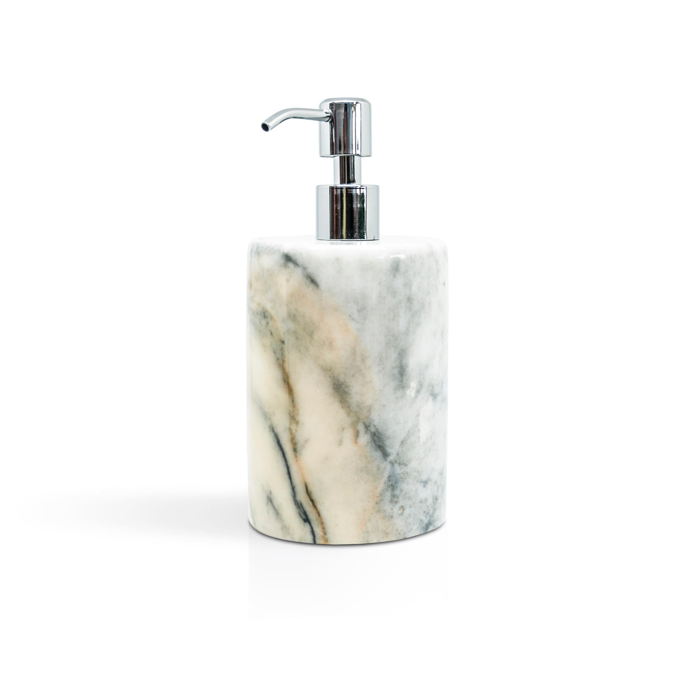 A rounded shape soap dispenser in Paonazzo marble.
Each piece is in a way unique (since each marble block is different in veins and shades) and handcrafted in Italy. Slight variations in shape, color and size are to be considered a guarantee of an