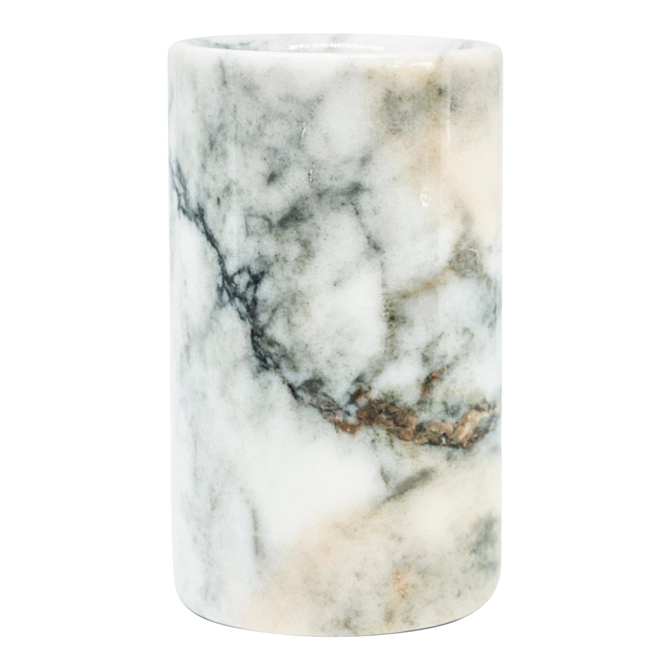 A rounded shape toothbrush holder in Paonazzo marble.
Each piece is in a way unique (every marble block is different in veins and shades) and handmade by Italian artisans specialized over generations in processing marble. Slight variations in
