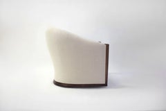 Rounded Tub Club Chair on Swivel Shown in Linen Fabric with Wood Arm Post Detail