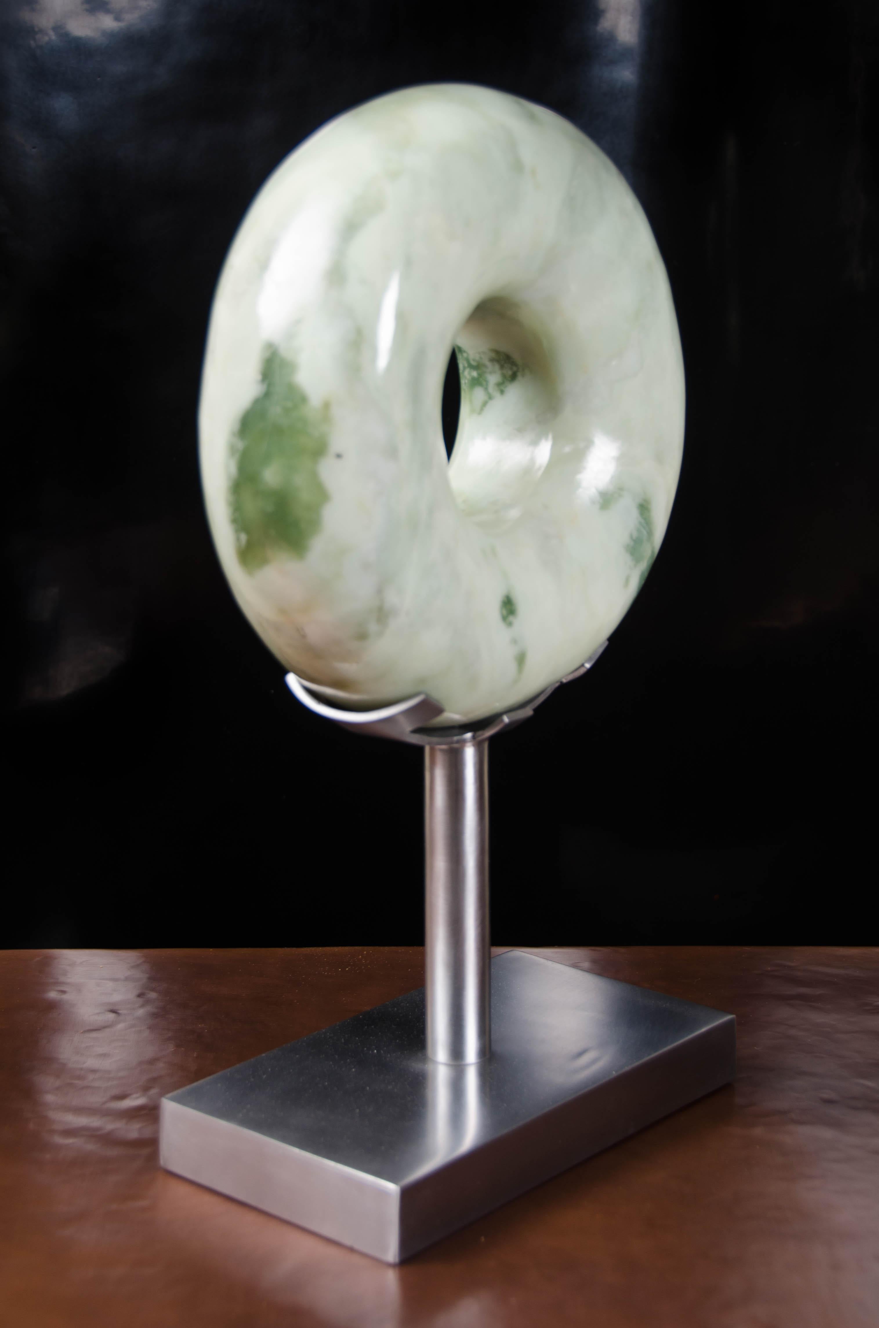 Rounded zong sculpture
Nephrite jade
Hand carved
Stainless steel
Hand repousse
Limited edition
Each individual jade vary in shapes and color

Known as the “Stone of Heaven,” Nephrite Jade is prized for both its aesthetic beauty and symbolic