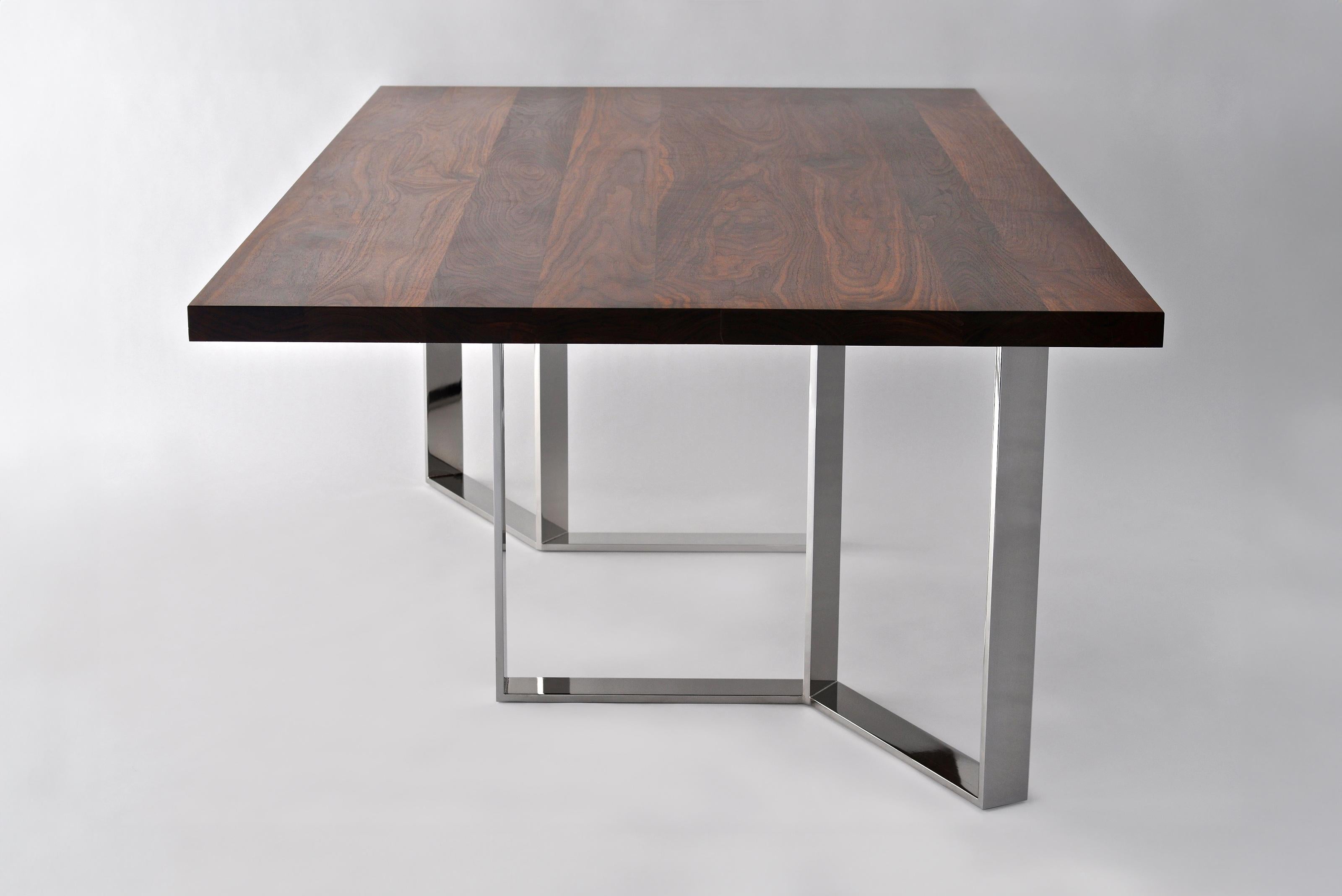 Roundhouse Table by Phase Design
Dimensions: D 116.8 x W 243.8 x H 73.7 cm. 
Materials: Polished chrome and walnut. 

Solid steel bar with solid wooden top, available in walnut, white oak, ebonized oak. Steel bar available in polished chrome, smoked