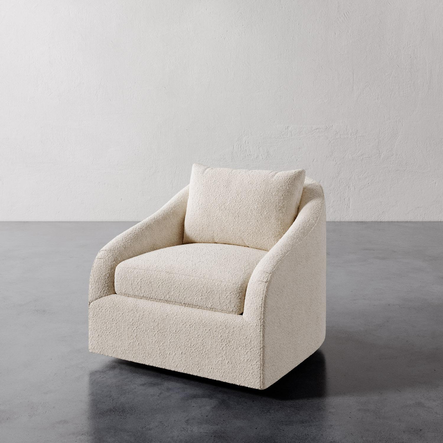 The Rousseau Swivel Chair from Lemieux et Cie is a study in quiet elegance, its graceful lines and sculptural silhouette evoking the refined restraint of 1940s French design. The subtly sloped arms lend a soft curvature, recalling the enveloping