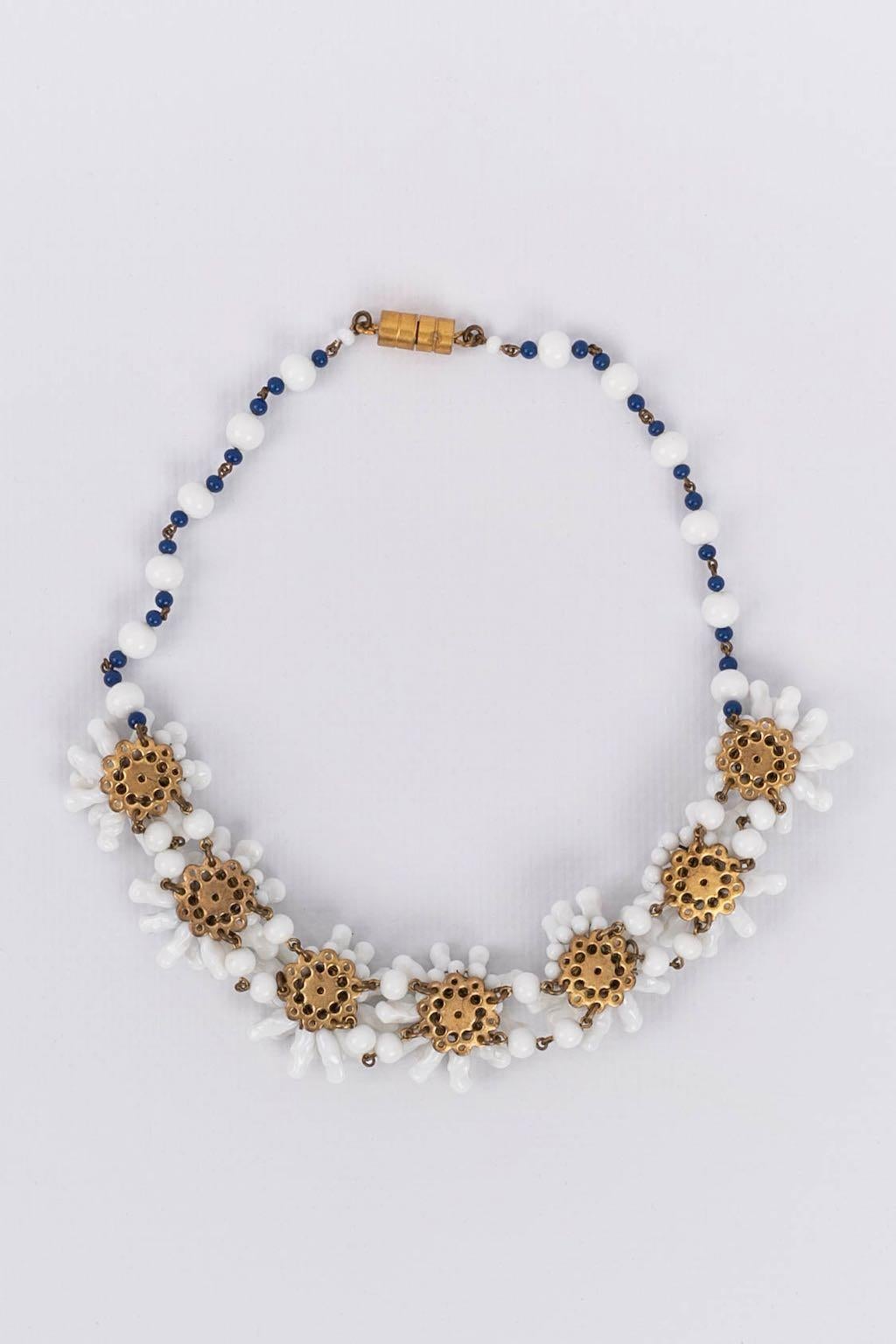 Glass paste choker comprised of floral elements. Manufactured by Rousselet workshop probably for Madeleine Rivière.

Additional information:
Condition: Good general condition. The glass paste is worn down
Dimensions: Length: 55 cm (13.77
