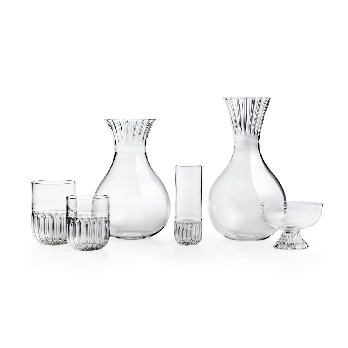 Low carafe in mouth blown glass. The routine collection is a glassware family designed by Matteo Cibic, who define it as “an essential collection for a smart daily life”. All the pieces of Routine, including this carafe, are handcrafted and feature