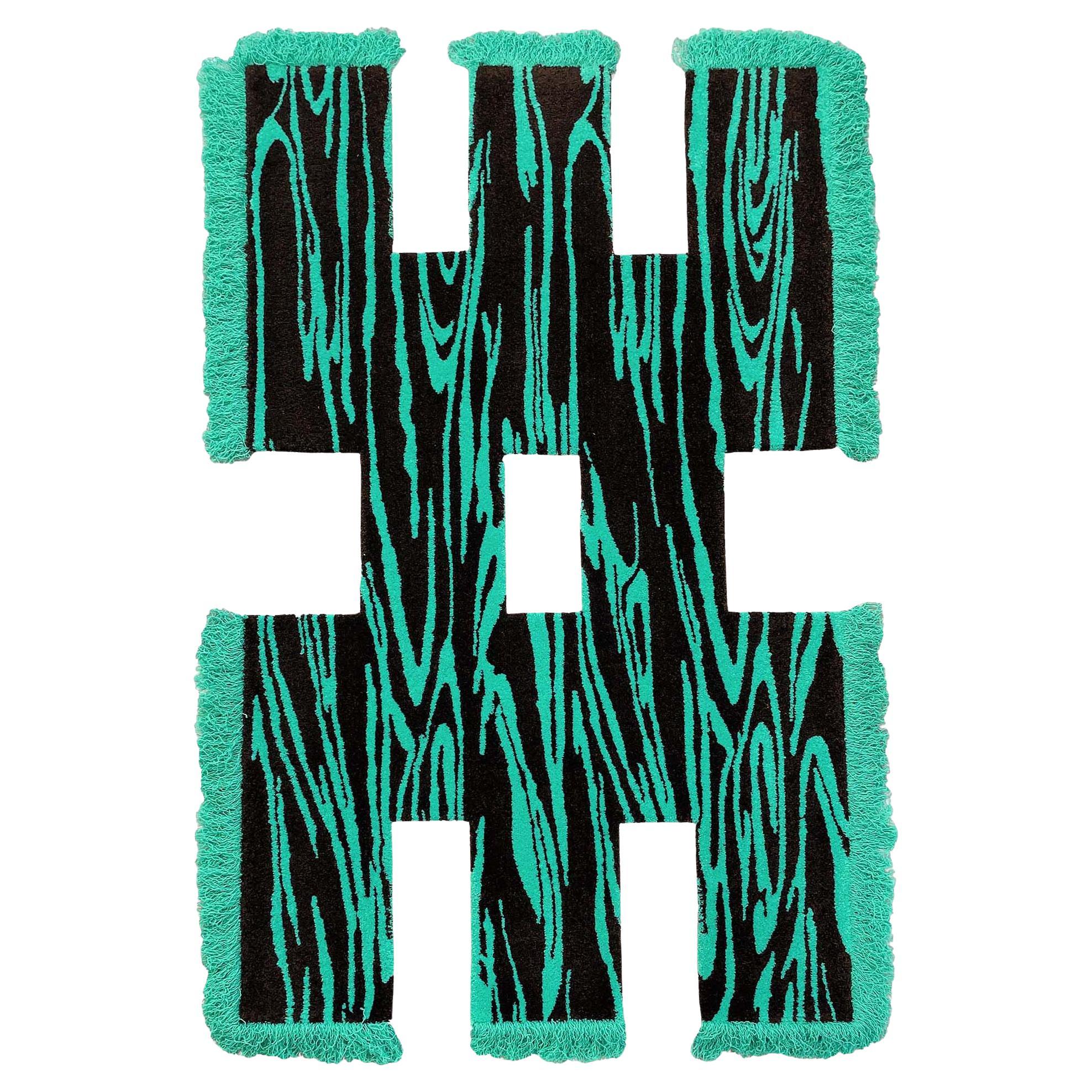 Tappeto unico Rowdy Wood Wood realizzato in nylon turchese e nero di Studio A
