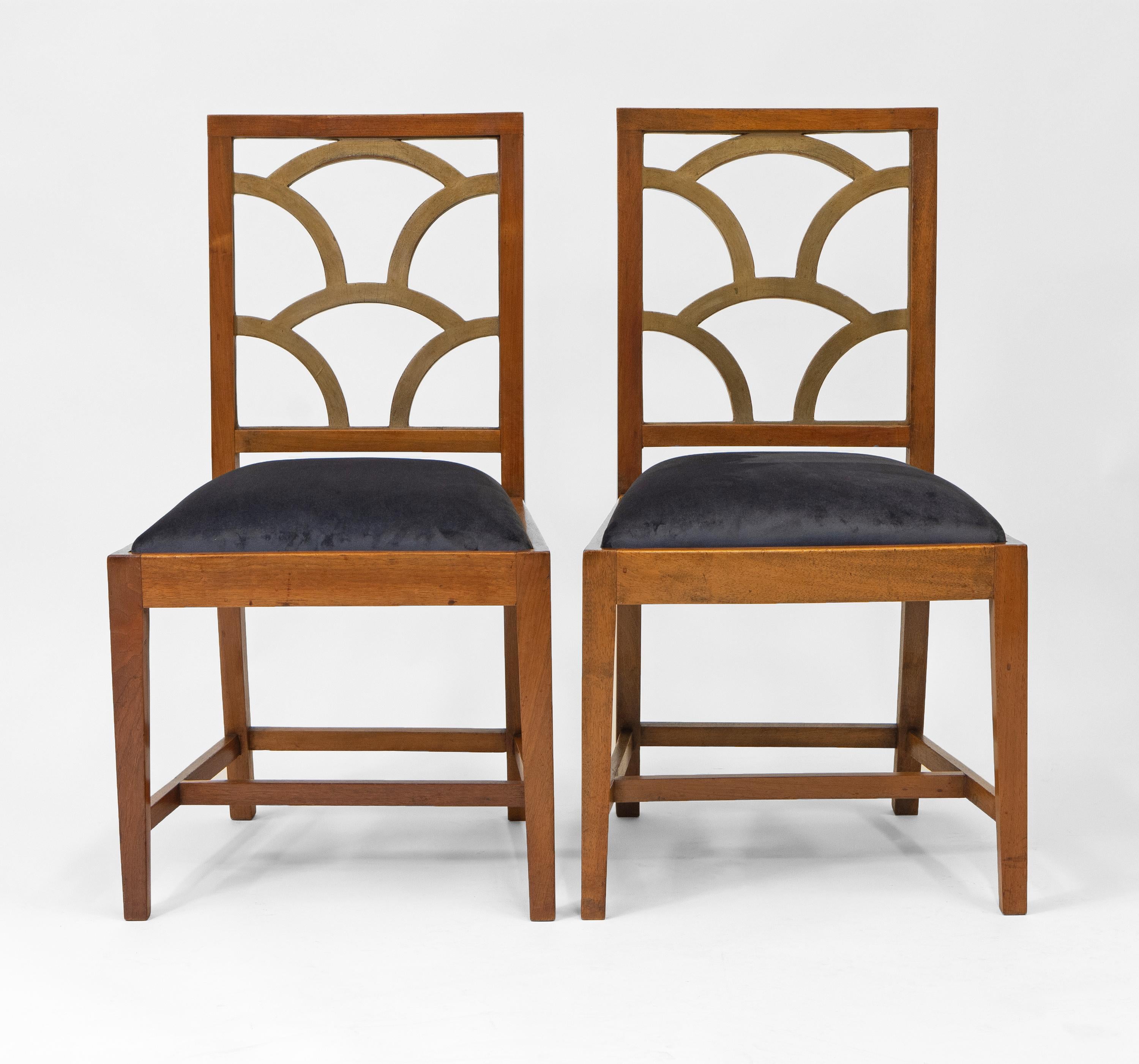 A pair of English Art Deco walnut side chairs with gold finished cloud-form back splats. Made by the Rowley Gallery. Maker's labels: 