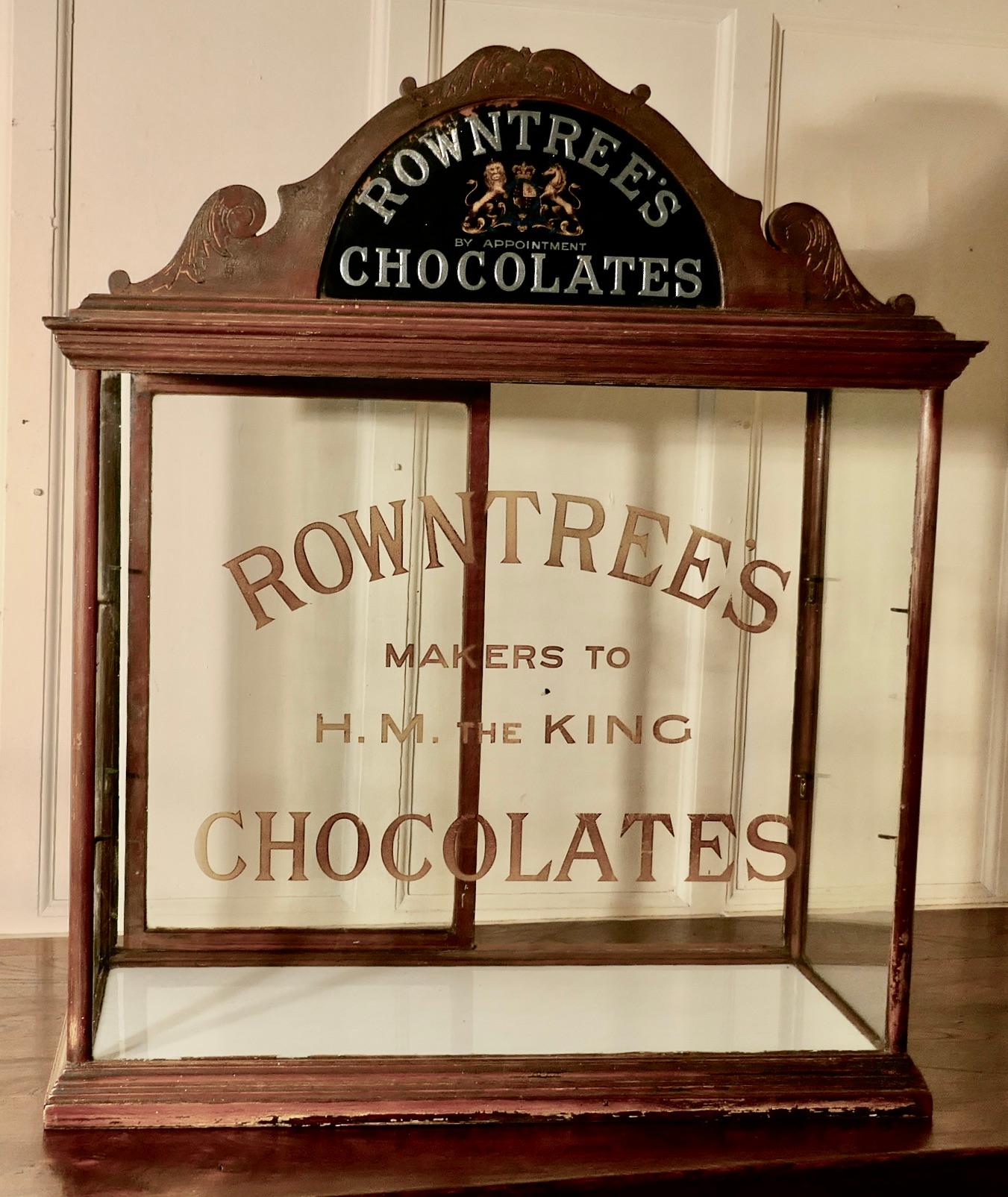 Rowntree’s Sweet shop display cabinet 

Advertising Shop Display Cabinet the cabinet has a rather grand carved cornice with a mirrored Royal Appointment sign and Chocolates in Gold and Silver
The Glass on the front of the cabinet is painted and