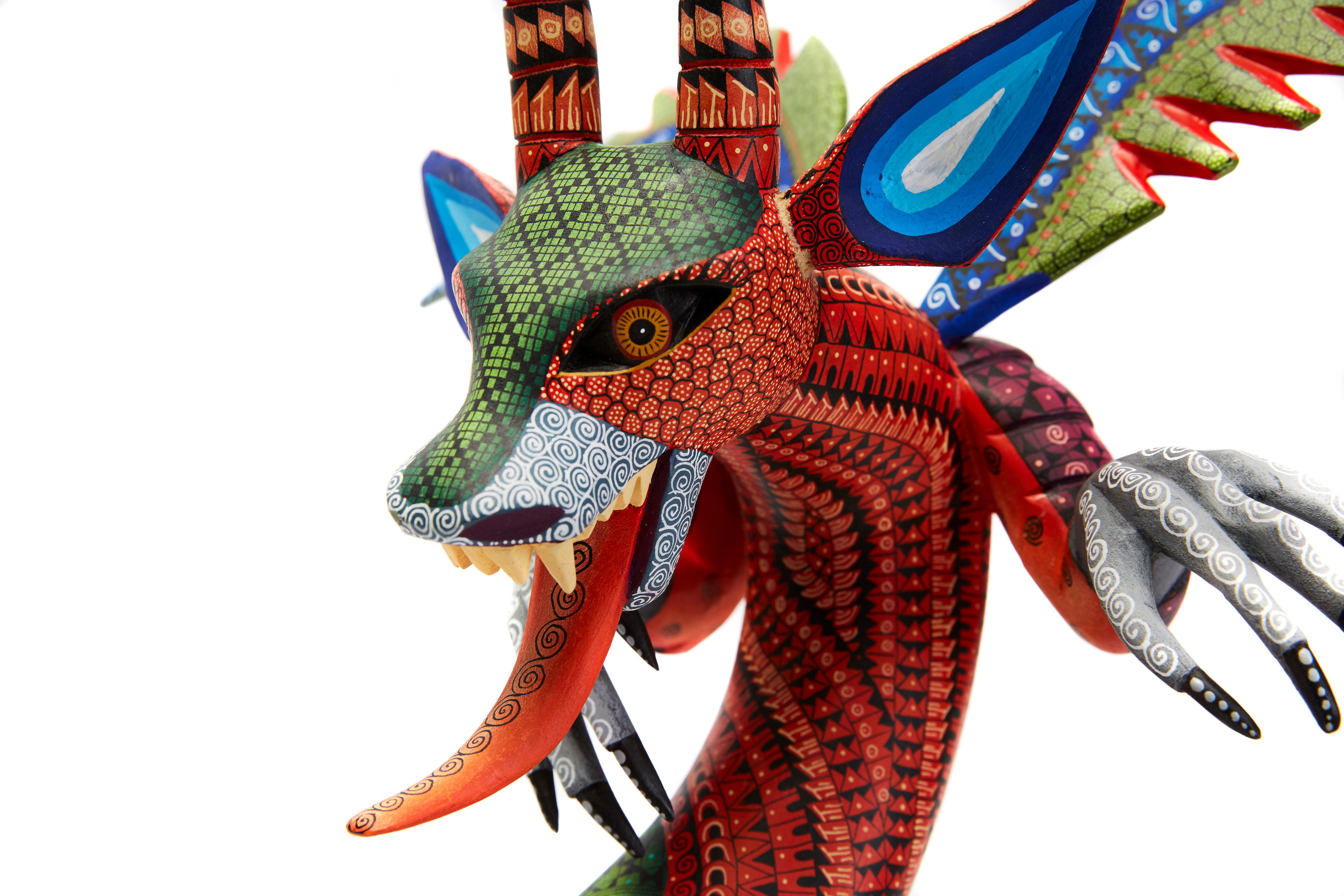 Dragon Fantastico - Fantastic Dragon Alebrije

This Mexican Fantastic Dragon Alebrije made with Copal wood, wood carving technique gouges, machete and sandpaper, decorated with acrylic paintings with Zapotec symbols.
At Cactus Fine Art, we offer an