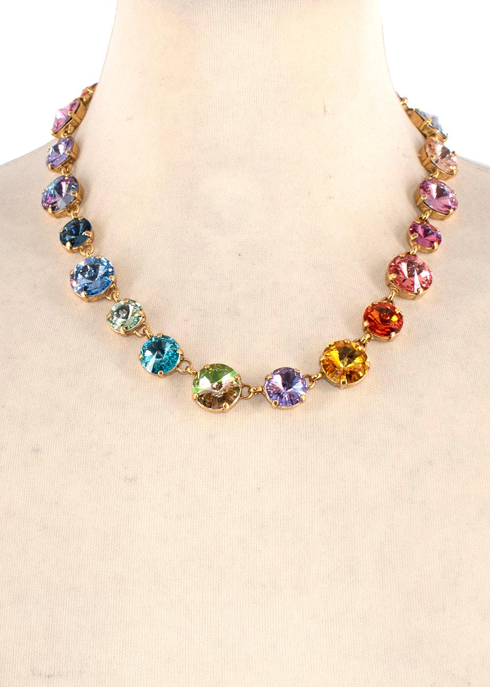 Roxanne Assoulin Technicolour Rainbow Crystal Necklace & Earrings 

- Large crystal gems set in a gold-tone metal surround
- Long drop earrings
- Short length necklace with lobster clap
- Rainbow assortment of colours

Measurements:
Necklace:
48cm