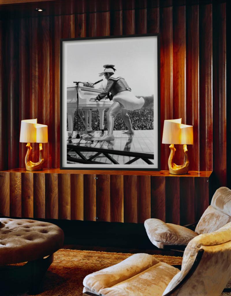 Elton John, the superstar on stage in a duck costume playing the piano photographed by the late  Roxanne Lowit.

All prints are limited edition. Available in multiple sizes. High-end framing on request.

All prints are done and signed by the artist.