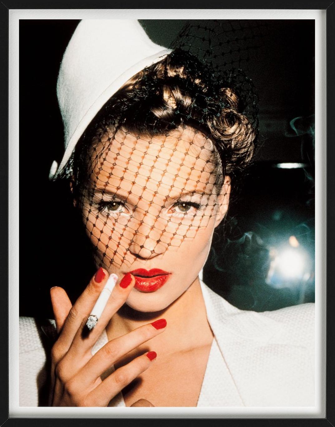 Kate Moss smoking a cigarette photographed by Roxanne Lowit.

All prints are limited edition. Available in multiple sizes. High-end framing on request.

All prints are done and signed by the artist. The collector receives an additional certificate