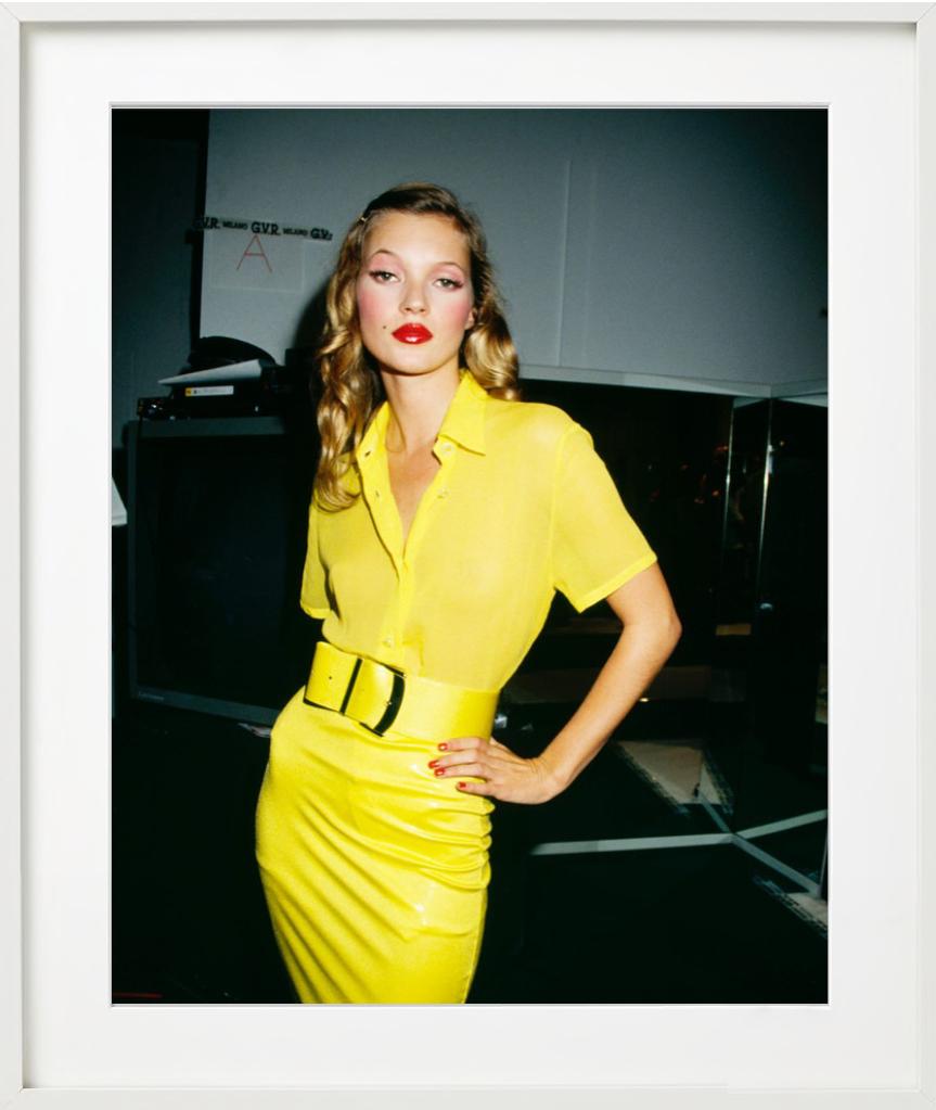 Kate Moss, in a Yellow dress looking at the Camera, Fine Art Photography - Black Color Photograph by Roxanne Lowit