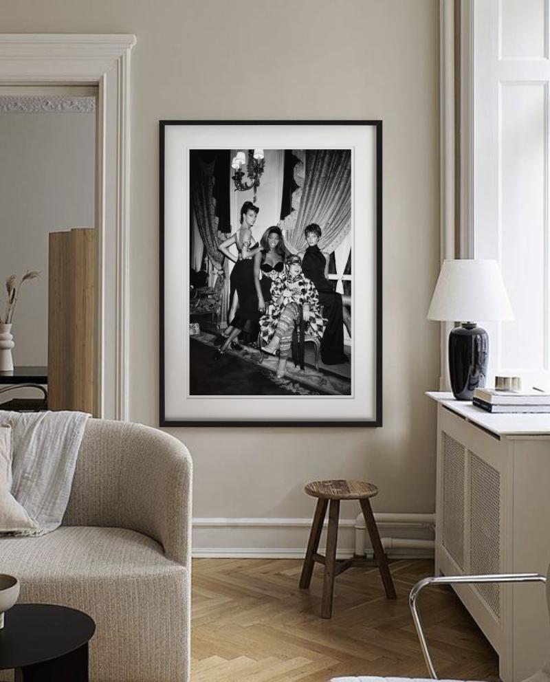 Three Supermodels Surrounding Fashion Icon Anna Piaggi at the afterparty of the Versave Couture Show held at the Ritz in Paris, photographed by Roxanne Lowit.

All prints are limited edition. Available in multiple sizes. High-end framing on