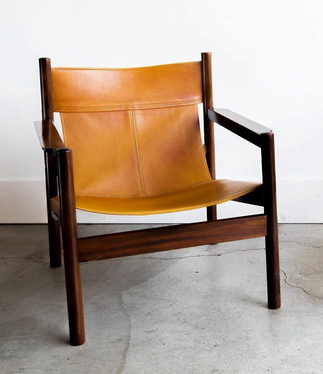 Roxinho vintage Safari armchairs in leather and wood by MCM Michel Arnoult, 1960s

A pair of truly amazing mid century Roxinho leather safari style lounge chairs by Michel Arnoult, circa 1960 Brazil. These chairs feature stitched high quality