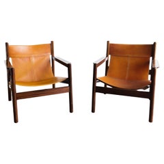 Roxinho vintage Safari armchair in leather and wood by MCM Michel Arnoult, 1960s